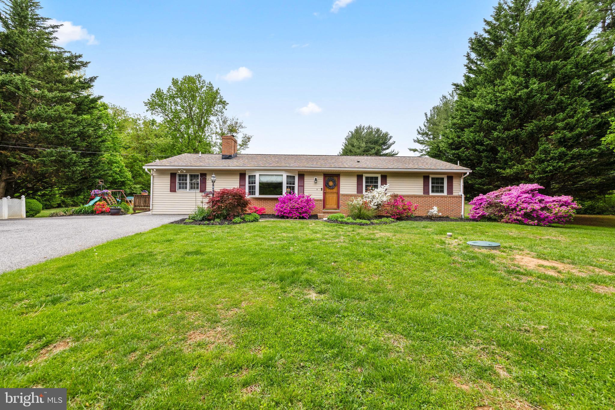 One level living at its finest! This charming rancher sits back off of the road with at least 7/8 spaces! Meticulously maintained and thoughtfully updated! A 4th bedroom and full bath were added  at one end of the house with it's own deck making it two primary suites! This cozy rancher has been updated throughout with stainless steel appliances, corian countertops, subway style backsplash, luxury vinyl flooring in the kitchen and dining area with hardwood floors in living room and bedrooms. All three baths have been completely updated with the third bathroom in the lower level added. A fantastic finished lower level family room with a bedroom, full bath, cedar closet, glass block windows and a spacious area of storage and a laundry room.  An outside entrance leads you to a level 1.48 acre lot offering a blend of cleared spaces and partially wooded areas ideal for outdoor activities or a peaceful retreat to a composite deck for your morning coffee and maybe some deer watching! For the last 21 years the current owners have numerous other updated amenities as the electric, a 50 year architectural shingle roof, 2022 water heater, invisible fence, well pump, custom curtains, replacement windows, hot water heater & more! Close to schools, churches, restaurants, shopping centers, watershed, NCR trails and parks all without losing that country vibe.  Experience the warmth and charm of this delightful residence in Phoenix Maryland!