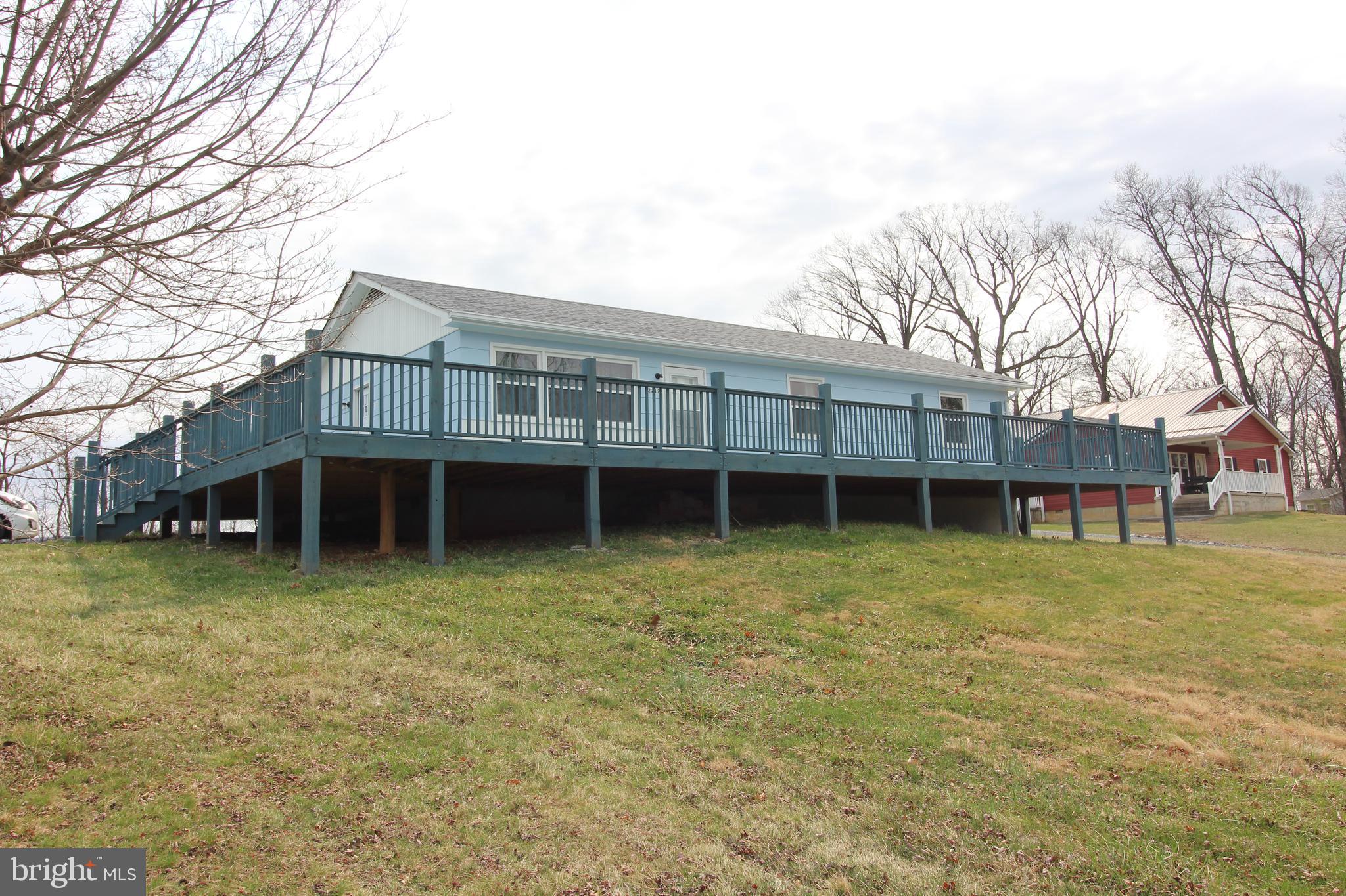 Come see this  3 Bedroom Ranch Style Home with One Bath. This adorable house in the country  is just waiting for a family to enjoy it! A Beautiful huge deck spans the entire front of the home and extends around the side Home has new replacement windows in 2023, New roof in 2021, New HVAC System in 2022. Offering a wonderful place to sit and enjoy the pastoral views of the countryside and the neighboring farms.
This property offers country living and the convenience of being a few short minutes to the town of Woodstock and all it has to offer, as well as being convenient to  the interstate for easy commutes.
This beautifully landscaped home  offers single level living and plenty of space for gardening on the almost 1 1/2 acres of ground. This is one to check out! Subject to Seller finding suitable Housing.