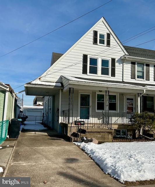 Welcome home to this quaint end unit in the Harriman Section of Historic Bristol Borough.  As you arrive, you can already see yourself relaxing on the covered front porch. This 3-bedroom, 1.5-bathroom home offers charm galore! As you enter, you are greeted with a spacious open concept living room and dining room area. Off the dining room is a large kitchen perfect for a kitchen island or an eat-in kitchen. The first level also offers a laundry area and ½ bath which adds to the convenience of the home. Upstairs offer 3 nice size bedroom and a full bath. Off the master bedroom there is the 3rd floor which could be used as a huge closet, workout area or storage! The home also offers a huge basement with plenty of space for storage or create additional living space for your needs. This end unit offers a large driveway for parking with a carport along with a garage/workspace.  All new windows installed in 2023. Don’t miss an opportunity to make this your home!