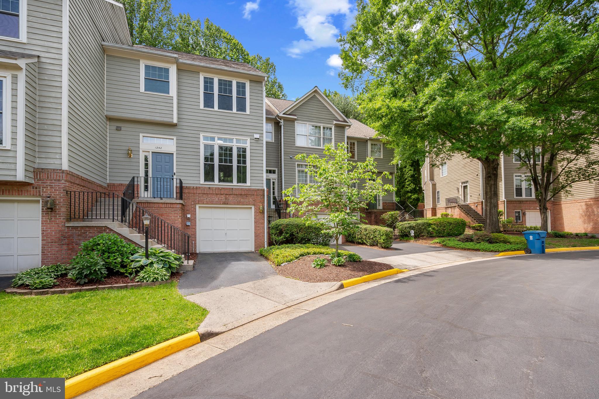 Welcome to 1242 Weatherstone Court, a beautifully updated move-in ready 3-bedroom, 2 full/2 half-bath townhouse with over $50,000 in upgrades over 2,100 square feet.

Step into luxury on the open-concept main level complete with vaulted ceilings, gleaming hardwood floors, and double French doors that fill the space with natural light. The expansive living and dining areas flow seamlessly to a private deck and fenced backyard. The updated kitchen features ample counter space, stainless steel appliances, separate pantry, and picturesque views of Weatherstone’s cherry blossom-lined pond. A renovated half bath completes the main level.

Upstairs, you’ll find three generously sized bedrooms and two completely renovated full baths. The primary suite is a true retreat with abundant space that easily accommodates a king-sized bed complemented by a walk-in closet and spa-like bathroom with 8-foot shower.

The finished basement offers a versatile space ideal for recreation or working from home. The cozy wood-burning fireplace, renovated half bath, updated laundry closet, and direct access to the garage blend convenience and comfort. With ample storage throughout, a one-car garage, driveway, and abundant guest parking, this home brings single-family convenience to the affordability of a townhouse.

Enjoy the best Reston has to offer with walking access to pools, tennis courts, playgrounds, and trails. Nearby North Point Village and Reston Town Center offer shopping, dining, groceries, and entertainment. Conveniently located for all commutes including Route 7, 286, Wiehle Metro stop, and more.

SELLER UPDATES INCLUDE: new roof, new windows, fully renovated bathrooms, exterior paint, plus much more!