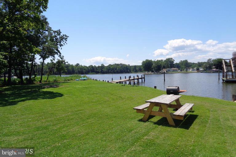 Waterfront Apartment Home on Shallow Creek!  Water views from every window! Rare opportunity! Near Ft. Howard & North Point State Park. Miles of trails and nature surround you. Bring your kayak, canoe, SUP, fishing pole, crab trap. Truly, an oasis! Kitchen includes Fridge & Stove/Oven, Microwave.  Full Bathroom with Bathtub.  New  HVAC Wall Units in Living Room and Bedroom;  provide energy efficient heating/cooling.  Water included in monthly rent. Electric, cable, internet paid by Tenant.  Common Laundry Room; coin operated (only three other apartments use common area laundry).  Only six total units in building in single family home neighborhood. Denton Ave is a Peninsula; water on both sides of the street! Close to 695; Key Bridge; Tradepoint Atlantic; Short commute to  Baltimore City.  NO ANIMALS/PETS ALLOWED IN APARTMENT OR BLDG. NON-SMOKERS ONLY. NON-SMOKING BLDG; LEAD FREE BUILDING.