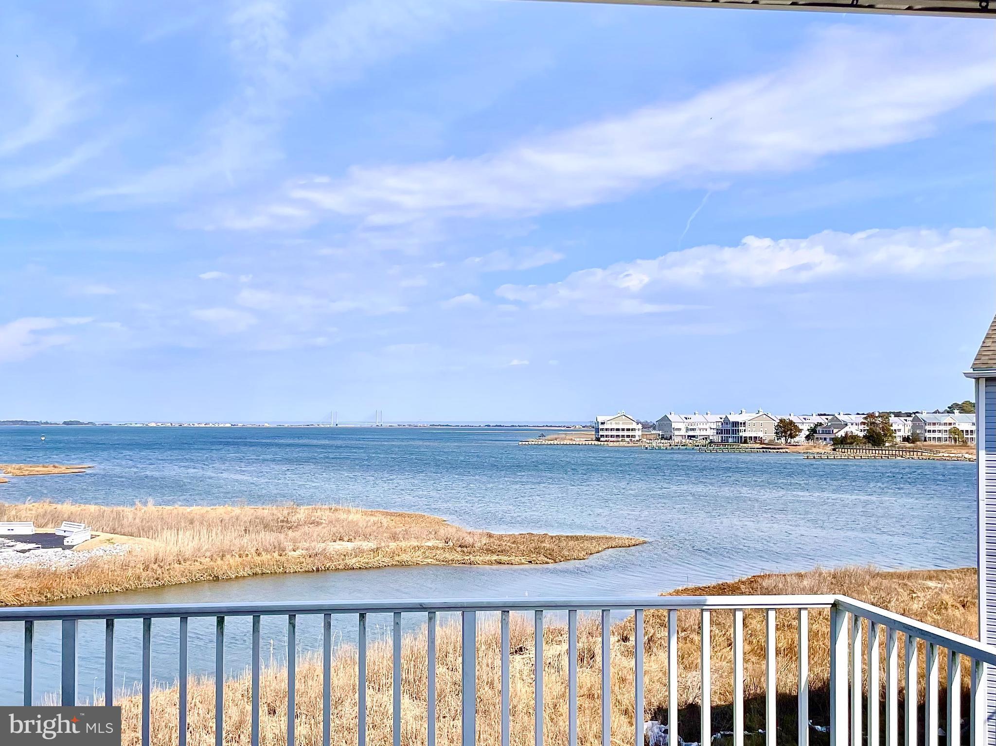 ABSOLUTELY STUNNING WATER VIEWS!  If you are looking for a coastal vacation getaway, permanent residence, or investment property, all options are possible for this bayside, 4-bedroom, 3 bath, furnished Bethany Bay condominium with a detached one-car garage.   This residence occupies the top two floors of the building boasting stunning, panoramic views of Indian River Bay and Bridge.  The main floor includes a combined living room and dining area opening onto a wide balcony overlooking the Bay.  Also on the main floor, there is the owners’ suite with private bathroom, a guest room with an adjacent bathroom, and eat-in kitchen.  The second floor includes two large bedrooms that share a full Jack-and-Jill bathroom.  This home is move-in-ready and fully equipped.  The home also includes a one-car garage.  For Investors, Bethany Bay attracts vacationers.  While carefully maintained, this unit has a reliable annual rental history.  No matter the owner’s use, Bethany Bay and Coastal Delaware are vibrant, year-round destinations. One-year Cinch Home Services warranty included.