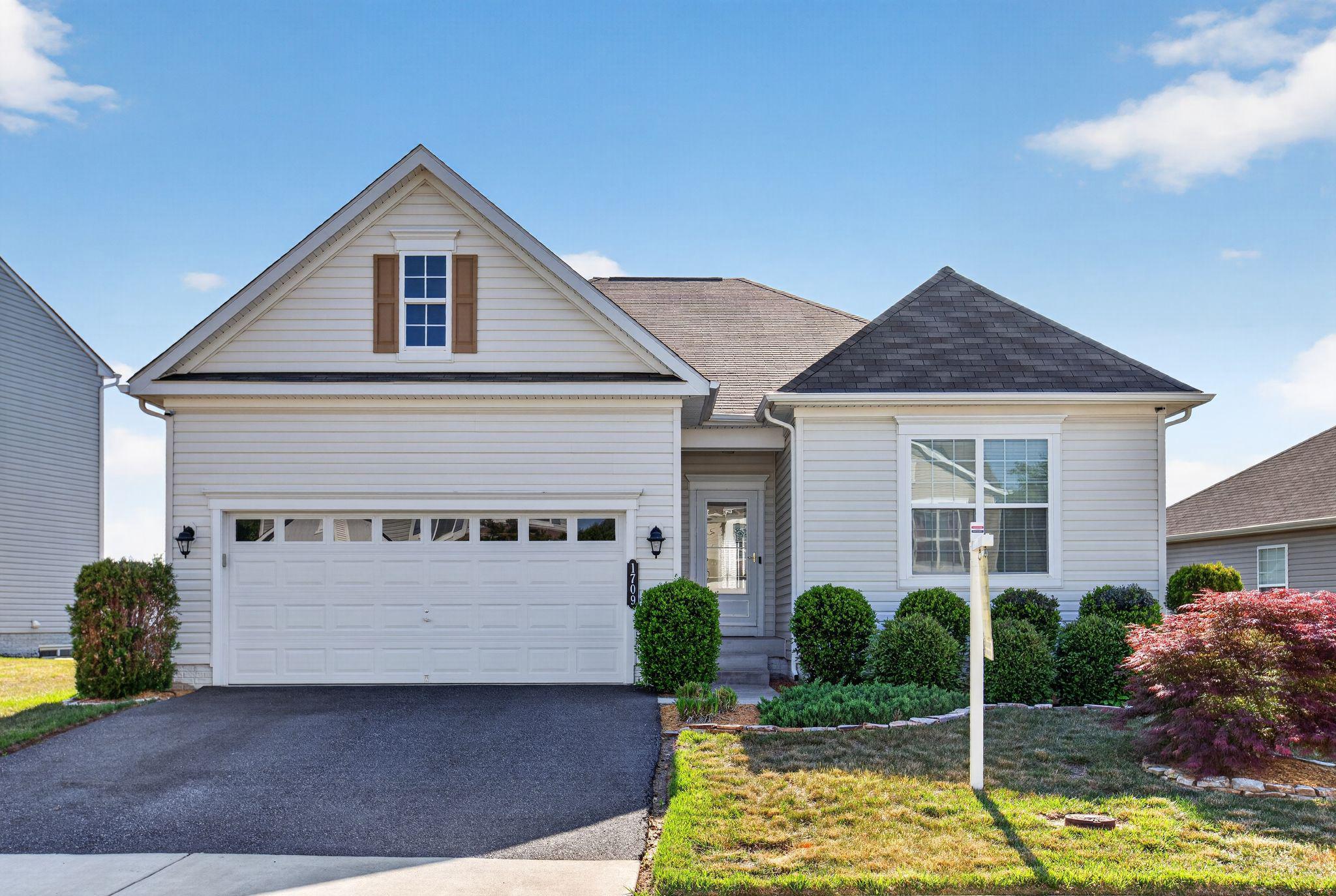 Nestled in the charming Summerfield community, this exquisite Colonial-style home, built in 2017, offers a perfect blend of modern comfort and timeless elegance. With four spacious bedrooms and three full bathrooms, this residence is designed to accommodate both relaxation and entertaining. Step inside to discover a warm and inviting interior featuring a harmonious mix of plush carpeting and rich wood floors. The gourmet kitchen is a chef's dream, equipped with stainless steel appliances, a built-in microwave, and a convenient island that invites casual dining. The adjoining breakfast area and family room create a seamless flow, perfect for gatherings or quiet evenings at home. The main level also boasts an entry-level bedroom, ideal for guests or as a private office space. The fully finished basement, complete with a walkout entrance, offers additional living space that can be transformed into a studio, playroom, or entertainment area. Ample storage is available throughout, including a pantry and walk-in closets, ensuring that everything has its place. Outside, the property features an attached garage with space for two vehicles and an asphalt driveway, providing convenience and ease. The community amenities include well-maintained jog/walk paths and tennis courts, encouraging an active lifestyle right at your doorstep. Living in Summerfield means enjoying the benefits of a vibrant neighborhood. With commuter lots and a rail station just a short drive away, commuting is a breeze. Nearby schools are known for their commitment to excellence, making this location ideal for those who value education. The association takes care of common area maintenance, snow removal, and trash services, allowing you to focus on what truly matters-creating memories in your new home. This property is not just a house; it's a place where you can build a life filled with comfort, community, and connection. Experience the warmth and charm of Summerfield, where every day feels like a retreat.