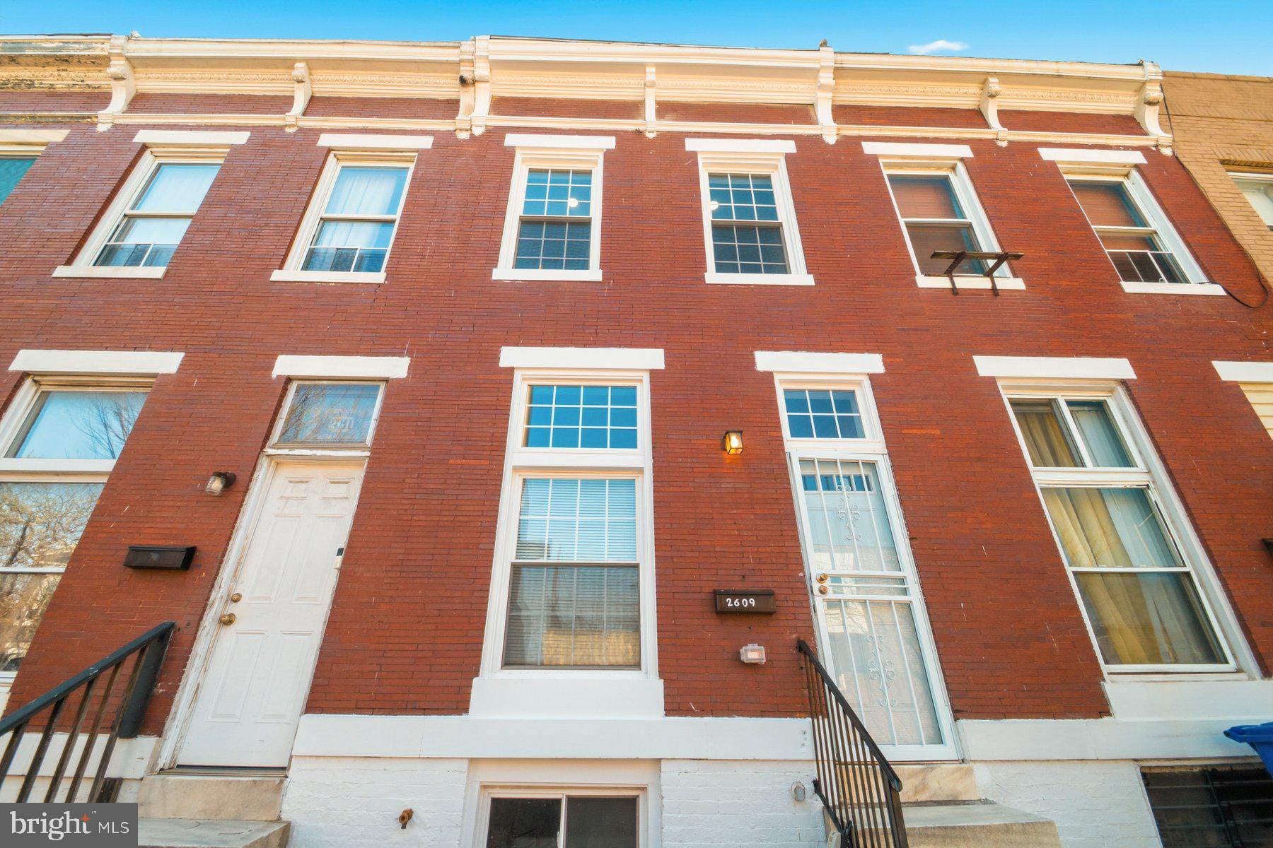 Completely renovated from top to bottom, this stunning Baltimore townhome is designed to impress even the most discerning buyer, featuring all-new electrical and plumbing systems, brand new roof, a high-efficiency HVAC for year-round comfort, and gleaming brand-new hardwood floors that serve as the showpiece throughout the main and upper levels. The gourmet kitchen is a true highlight, outfitted with sleek stainless-steel appliances and modern finishes perfect for both everyday living and entertaining. Step outside to enjoy a private back deck and patio, ideal for relaxing or hosting guests. Basement has a bedroom and a full bathroom, also a huge den that can become your 4th bedroom.  Conveniently located near local shopping, dining, and major commuter routes, this home offers the perfect blend of luxury, comfort, and accessibility—an exceptional opportunity for a buyer who appreciates quality and style.  This one is a must see, make your appointment today.