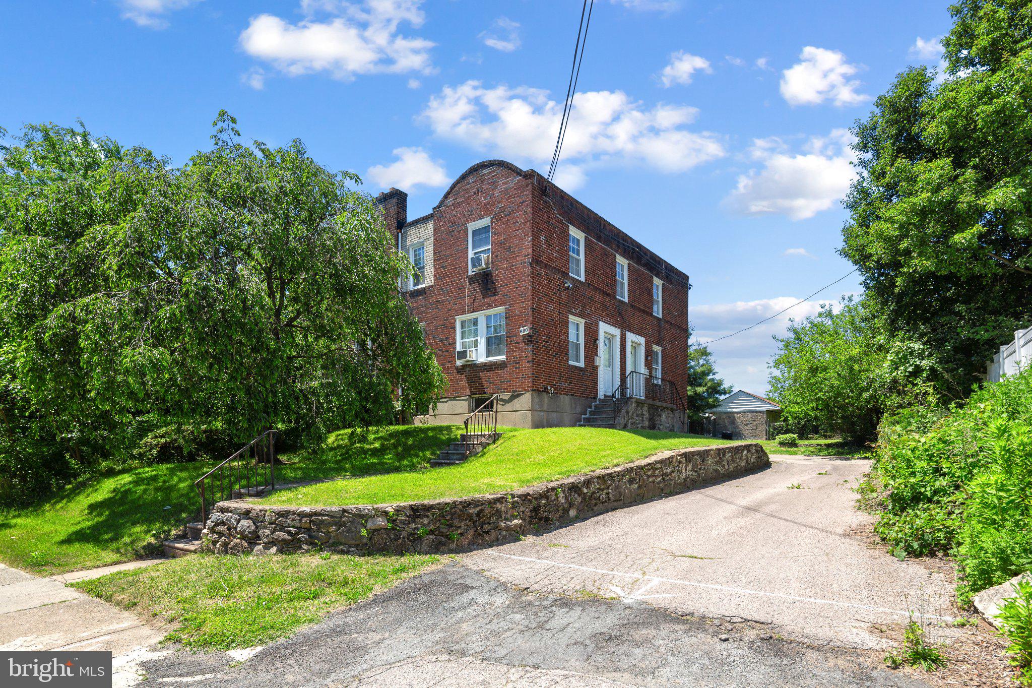 This is more than a chance to buy a duplex — it's a rare opportunity to enjoy a lifestyle many dream of without ever leaving the city.

Tucked away in the hidden enclave of Blue Bell Hill, one of Northwest Philadelphia's best-kept secrets, this meticulously maintained duplex offers the perfect blend of nature, convenience, and long-term opportunity. Surrounded by mature trees, historic stone homes, and some of the city's most beautiful green spaces, you'll find yourself just steps from Blue Bell Park, Clifford Park, and the trail network of the legendary Wissahickon Valley Park, home to over 50 miles of hiking, biking, horseback riding, and walking trails.

Whether you're seeking an owner-occupied investment, multigenerational living, or a turnkey addition to your portfolio, this property delivers. Each unit offers two spacious bedrooms, one full bathroom, and approximately 750 square feet of comfortable living space. A shared basement provides laundry, private storage lockers, and access to the attached two-car garage.

Lovingly cared for by the same owner for more than 35 years, the property has benefited from continuous improvements and thoughtful updates over time, including electrical, plumbing, windows, exterior doors, and garage doors. Most recently, a brand-new roof was installed in April 2026. Constructed of durable brick and cinder block, it was built to stand the test of time.

Situated on the largest lot in the development and occupying a desirable corner position, the 7,095-square-foot parcel offers a private backyard with room to garden, entertain, expand, or simply enjoy the peaceful surroundings.

Despite its tucked-away feel, everything is within reach. Walk 10 minutes to the Tulpehocken Regional Rail station, commute easily to Center City, City Avenue, I-76, or Lincoln Drive. Enjoy a round at Walnut Lane Golf Club, shop at Weavers Way Co-op - Mt. Airy, or take advantage of nearby educational institutions including the highly regarded The Waldorf School of Philadelphia.

Properties like this rarely become available — a unique combination of income potential, outdoor lifestyle, neighborhood charm, and city accessibility in one of Philadelphia's most distinctive pockets.