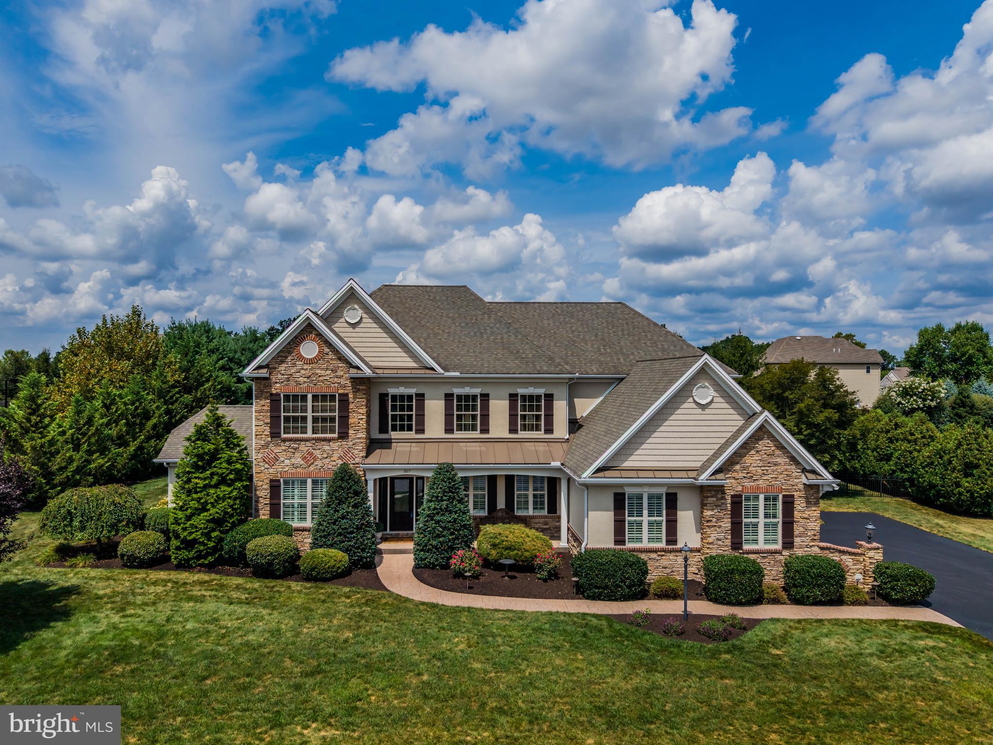 Welcome to 507 Jonagold Circle in Mechanicsburg, located in the highly desired Mechanicsburg Area School District. This beautiful 4-bedroom, 4.5-bath home offers hardwood flooring, soaring ceilings, and a newly remodeled kitchen that flows into a light-filled four-seasons sunroom. Upstairs features a convenient second-floor laundry alongside the bedrooms, while the fully finished basement includes a room designed for a cinema/theater. The three-car garage comes complete with a built-in dog wash, and the backyard is made for entertaining with a covered patio, two-sided fireplace, and a large flat yard perfect for a pool or play. Thoughtfully designed with both elegance and functionality, this home is move-in ready and waiting for its next owners.