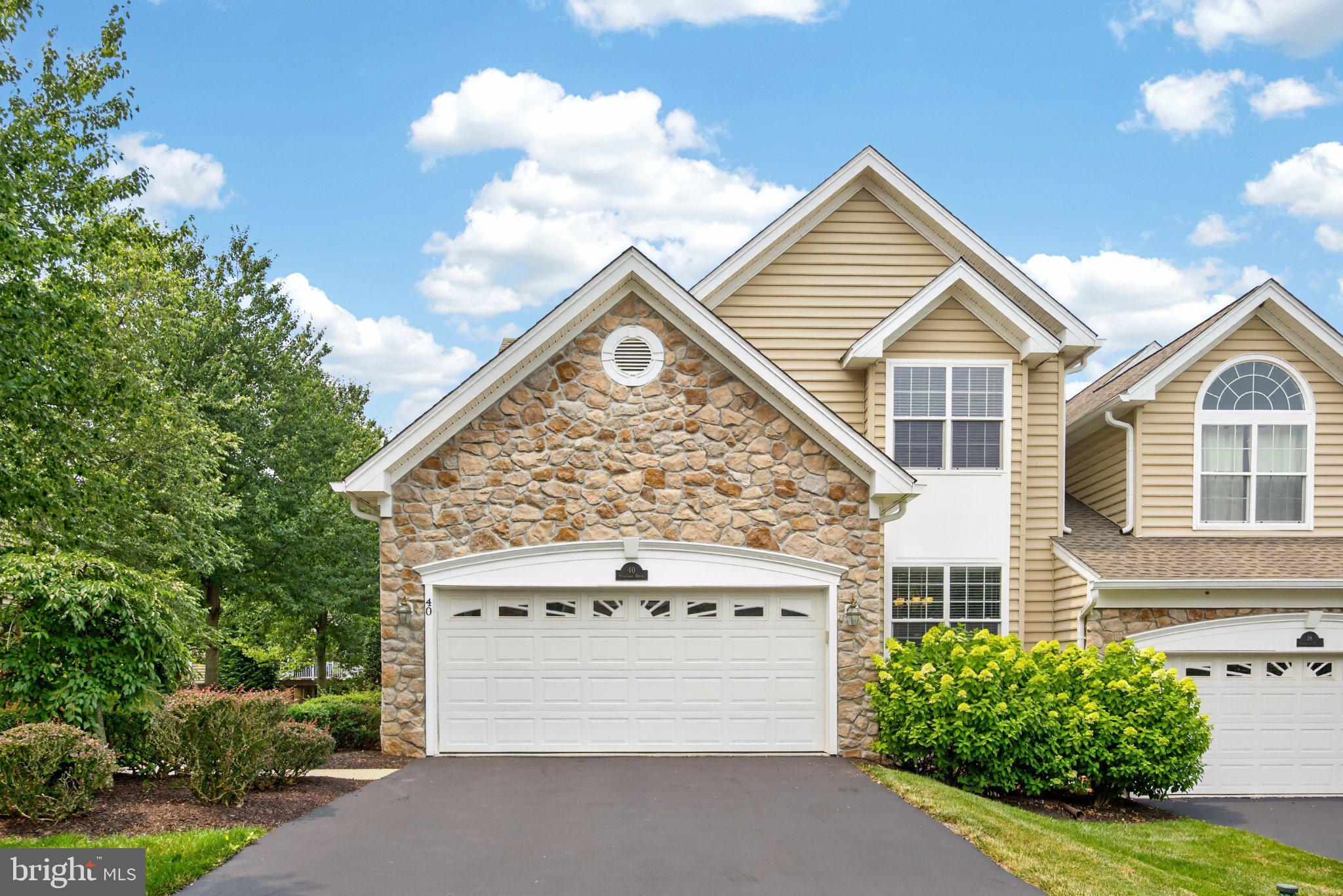 Upgrades galore in this lightly lived-in home! Nestled in the prestigious and conveniently located Charlestown Meadows, this exquisite end-of-row townhouse embodies the pinnacle of luxury living. Built in 2005, this gem boasts 2,754 square feet of meticulously designed space, offering an unparalleled blend of comfort and sophistication. The main level features an inviting living area highlighted by a cozy fireplace, setting the stage for intimate gatherings or serene evenings at home. The open-concept layout seamlessly connects the living, dining, and kitchen areas, ensuring effortless flow and an abundance of natural light. The gourmet kitchen is a culinary enthusiast's dream, equipped with high-end appliances and ample counter space, making it ideal for both casual meals and grand dinner parties. Retreat to the luxurious, main level, primary suite, where tranquility reigns, complemented by spa-like en-suite amenities and oversized closets. Step downstairs to the lower level to discover a high-end, fully finished basement with bar area and full bath, perfect for entertaining or creating a private retreat. The attached garage and driveway provide convenience and ease, while the low-maintenance, high-reward setting allows for more leisure time to indulge in the exclusive lifestyle this community offers. Experience the perfect blend of elegance and modern living in this stunning townhouse, where every detail has been thoughtfully curated for the discerning homeowner. The HOA covers all exterior maintenance, snow removal, and trash service. Enjoy the clubhouse, resort-style community pool, fitness center, tennis courts, and walking trails throughout. Embrace a lifestyle of luxury and comfort in Charlestown Meadows. Your dream home awaits!
