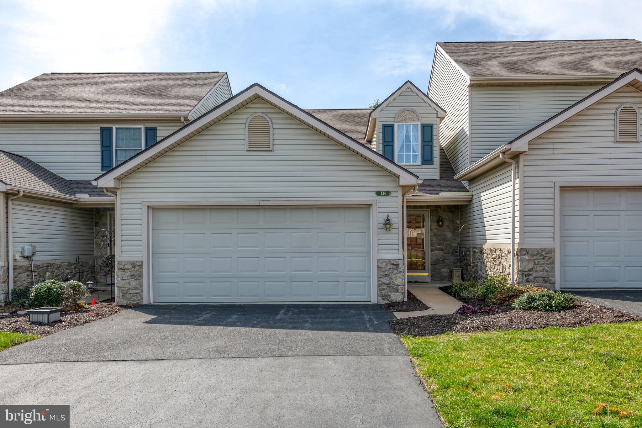 Carefree first floor living in Mt Joy! This very well-maintained Grandview Meadows townhome offers a beautiful open floor plan.   When you enter this home, you will be impressed with the cozy open feel of the living room, with vaulted ceiling and beautiful stone fireplace.  The living room adjoins the kitchen area, which includes a dining area, concealed laundry, and kitchen island.  Pass through the kitchen to a sun-filled 4 Season room.  Perfect for enjoying your morning coffee/tea, bird watching or a relaxing dinner with friends and family.   There is a large first floor primary suite with walk-in closet and large primary bathroom.  The second floor includes two additional bedrooms, a full bathroom and large loft area.  This townhome also includes an attached two car garage, half bath and unfinished lower level.  Conveniently located close to grocery stores, restaurants & shops.  Schedule your showing today.