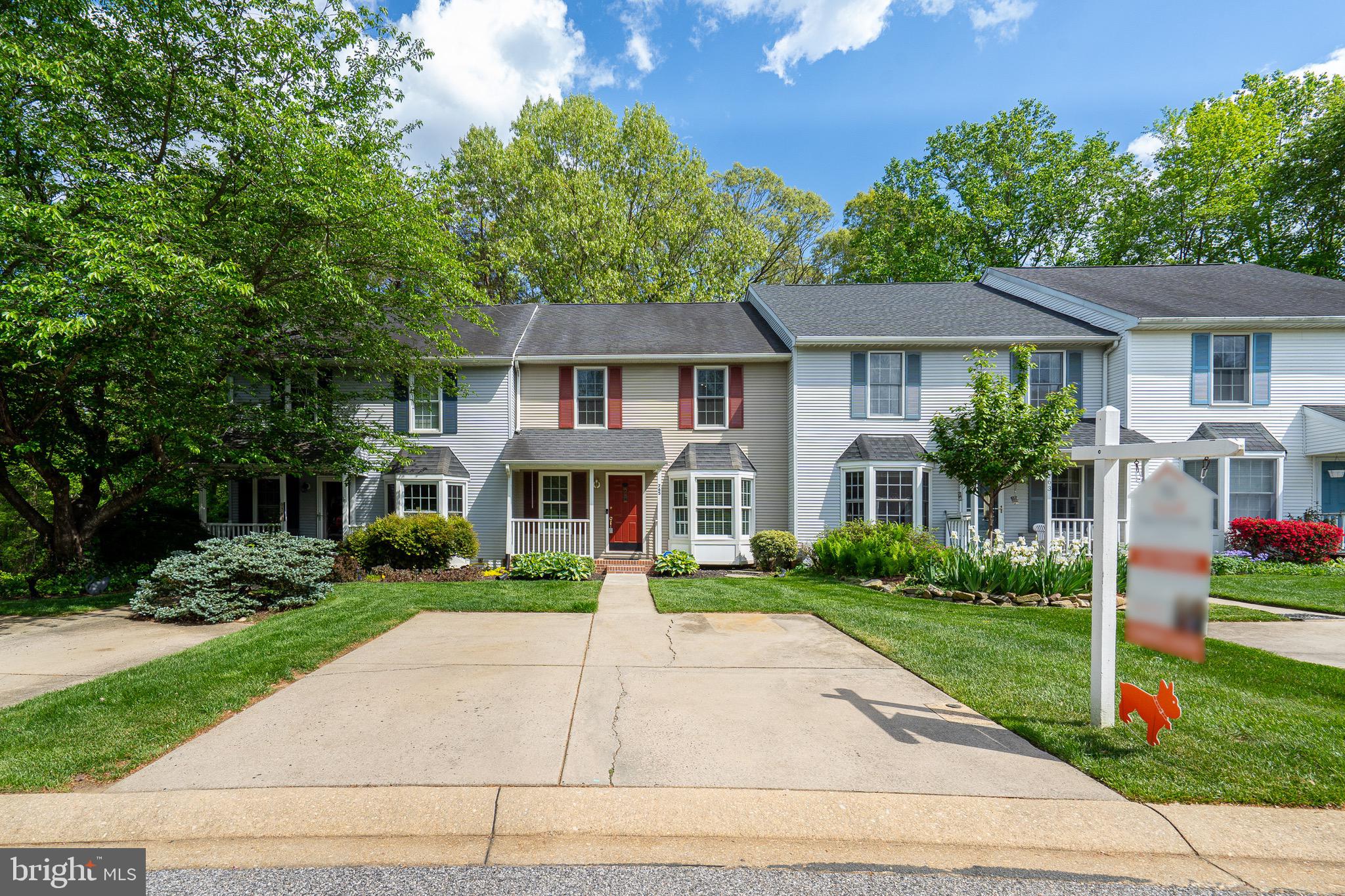 Rare Opportunity in The Cedars! Don’t miss this spacious and beautifully maintained 3-bedroom, 2 full-bath, and 2 half-bath townhome nestled in the sought-after community of The Cedars. 
At 24’ wide, this home offers an open, airy layout and backs to a serene wooded setting, ideal for relaxing or entertaining on the oversized deck or the lower-level paver patio.
Step inside to find a bright kitchen with white cabinetry, granite countertops, stainless steel appliances, and a charming bay window that fills the space with natural light. The adjoining dining area and sunken living room feature striking bamboo flooring and elegant molding, while grand 9’ patio doors provide seamless access to the expansive deck.
Upstairs, the luxurious primary suite includes a vaulted ceiling, walk-in closet, and a spa-inspired bath with a soaking tub, separate shower, and skylight. Two additional bedrooms and a full hall bath offer plenty of room for family or guests.
The finished walk-out basement adds incredible versatility, complete with a half bath, laundry/storage area, and direct access to the patio. Additional perks include a two-car concrete driveway and plenty of guest parking. This rare gem won’t last long! Schedule your showing today!