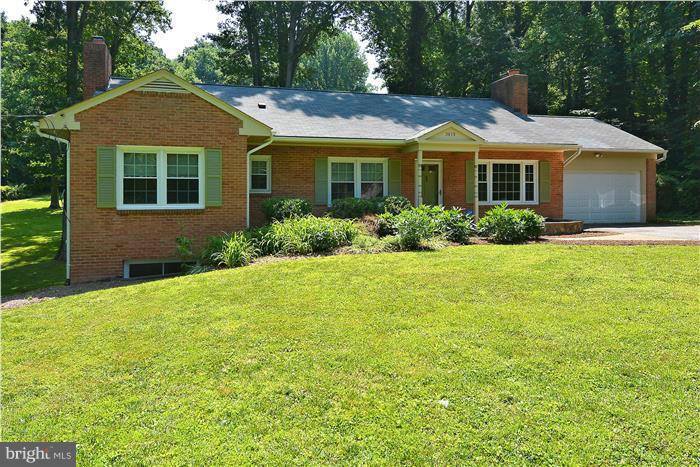 Wooded, Tranquil 1.3 acre lot (Newly divided so not correct on tax record) New energy efficient windows New custom kitchen w/ Stainless Appliances Unique and stylish sunroom that overlooks park-like yard Hardwoods on Main Lvl 2 relined, recapped fireplaces 3 full baths Bonus room on LL Huge storage room Lots of extra storage space 2 car garage Located Near Hidden Oaks Nature Center Home Warranty