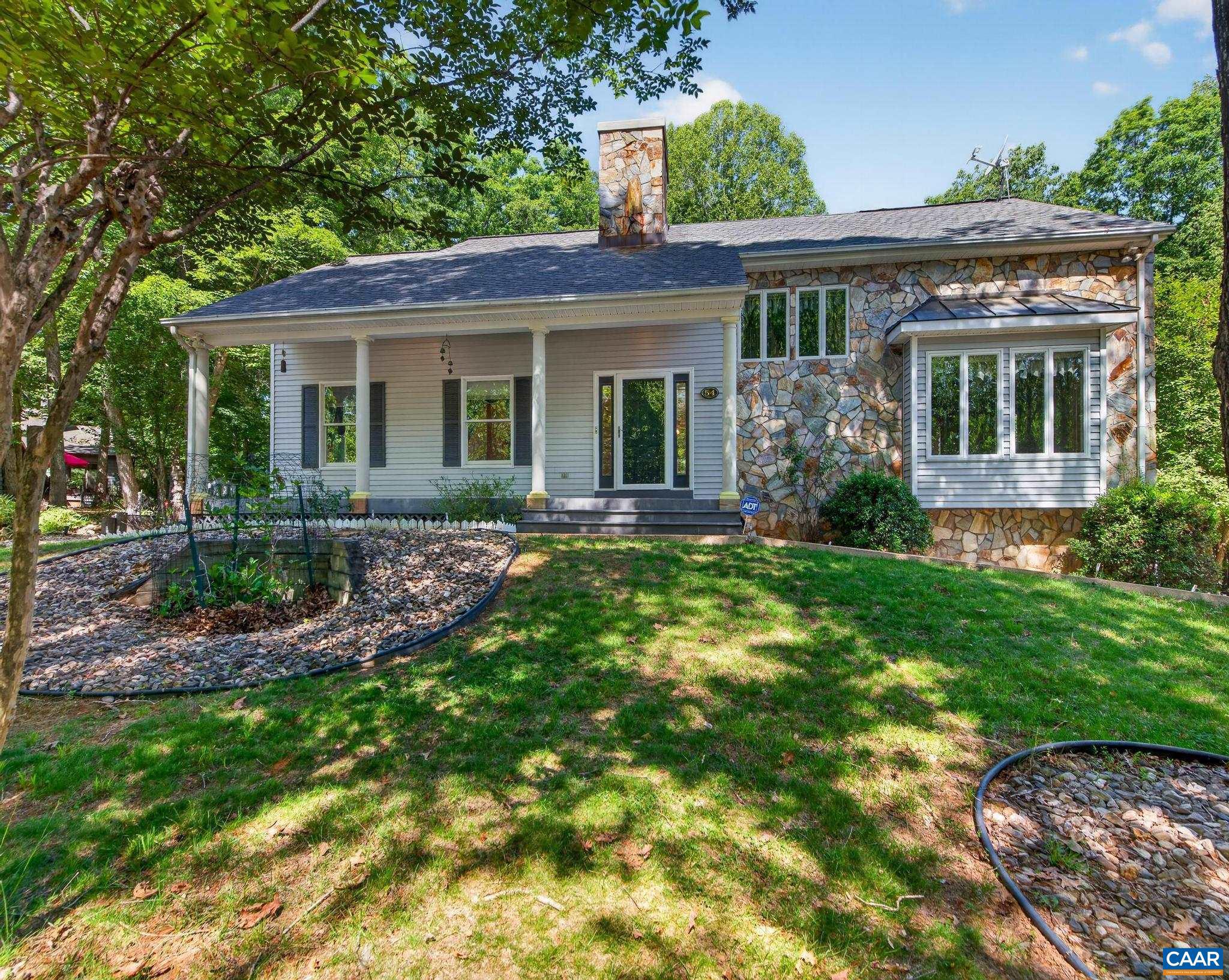 Welcome to this beautiful CUSTOM Designed & CUSTOM Built, one-owner home tucked among the trees in Lake Monticello. Offering 3-4 BR, 3.5 BA, vaulted ceilings, hardwood floors & a first-floor Primary Suite plus FLEX space & full bath on the Terrace level. At less than $174 per SF this home represents VALUE !!  The Great Room w/stone fireplace flows into the dining area & kitchen, while walls of windows invite natural light & wooded views inside.  Large rear deck & screened porch overlook the tranquil landscape. The school bus stops right in front & it's a quick walk to Beach 3.  The finished walk-out lower level offers flexibility w/generous living space ideal for a Man Cave, Media Room, Guest Suite, Rec. Room, home office, gym, or possible 4th BR w/Full Bath.  Outside, three established koi ponds w/fish included create a private garden retreat unlike anything else currently on the market in Lake Monticello. Mature landscaping & multiple outdoor living areas make this property feel like a hidden escape.  Additional highlights include a 2-CAR garage, whole house generator, abundant storage, corner lot location & loads of over-flow parking. First time ever offered for sale by the original owners. $5000 painting/decorating allowance.,Granite Counter,Oak Cabinets,Fireplace in Great Room