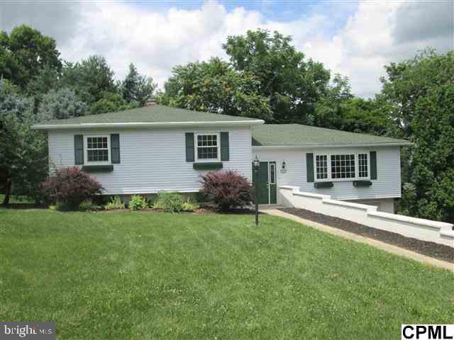 Spacious split level with new drywall, kitchen & baths. 6 bedrooms, 3 full baths, family room with fireplace opens to large sunroom with vaulted ceilings. Additional covered deck off dining room. New carpet and vinyl flooring just installed. Approx. 2619 sqft of living space- perfect for growing family.  Qualifies for USDA financing.