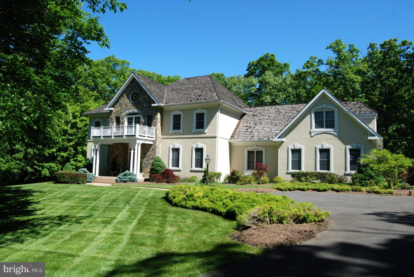 NEW LISTING!  DON'T MISS OUT on this gorgeous 5-acre estate has it all:  Location. Privacy. Elegance.  Sumptuously styled and impeccably maintained offering 5 en-suite bedrooms.  The 2-story lobby invites you into a gracious floorplan that is perfect for entertaining or nesting with the family.  Some of the many features include custom moldings, architectural accents, Palladian windows, hardwood floors, and extensive professional landscaping.  Richly appointed millwork and built-ins throughout the many large, light filled main living areas. 5 Fireplaces, a classic paneled Library, Butler's Pantry with wet bar/wine fridge, and a finished lower-level Great Room accent this lovely home. 3-car Garage plus enormous additional storage space.