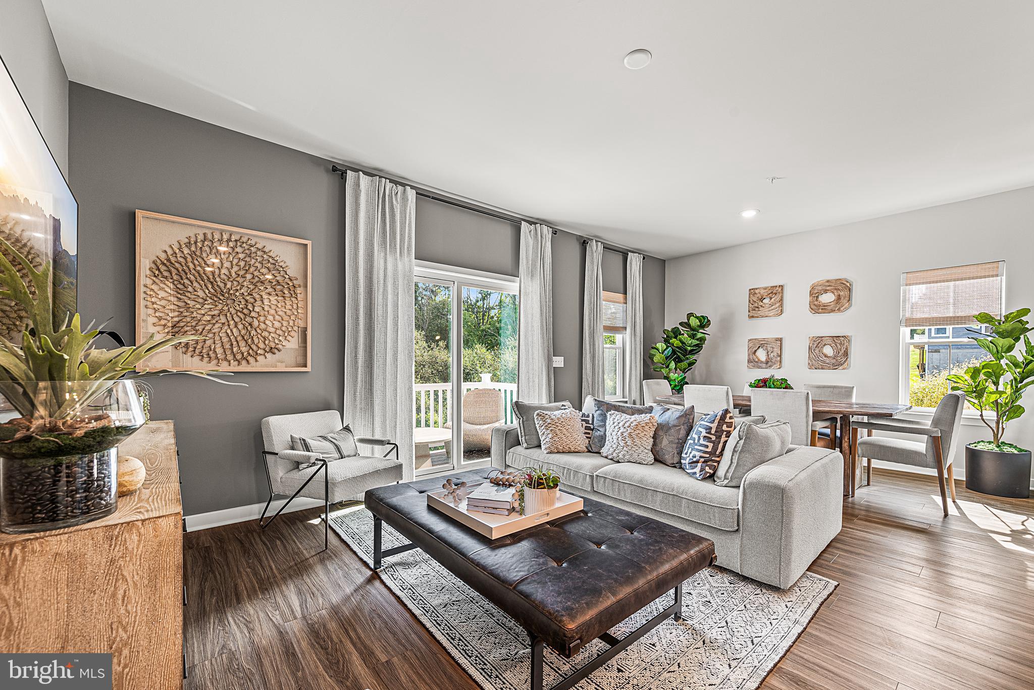 Now Available, the Brynley Model Home at Brookside Court! If you're looking for new construction without the typical wait time, this it it! 7596 Clayton Avenue at Brookside Court at Upper Saucon is located in the highly rated Southern Lehigh School District. This Brynley floorplan is a two-story home that features a modern, open-concept layout situated amongst the kitchen (complete with granite counters & white cabinets), dining room and Great Room with an attached 10x10 deck-  perfect for seamless everyday living. Upstairs is a central loft area well-suited for a reading nook or home office space, surrounded by a spacious laundry room and two secondary bedrooms — each with a convenient closet. In a private corner, the primary suite showcases an adjoining bathroom and a large walk-in closet. Completing the home is a 1.5-car garage and large finished basement with half bath - perfect as an extended living space.