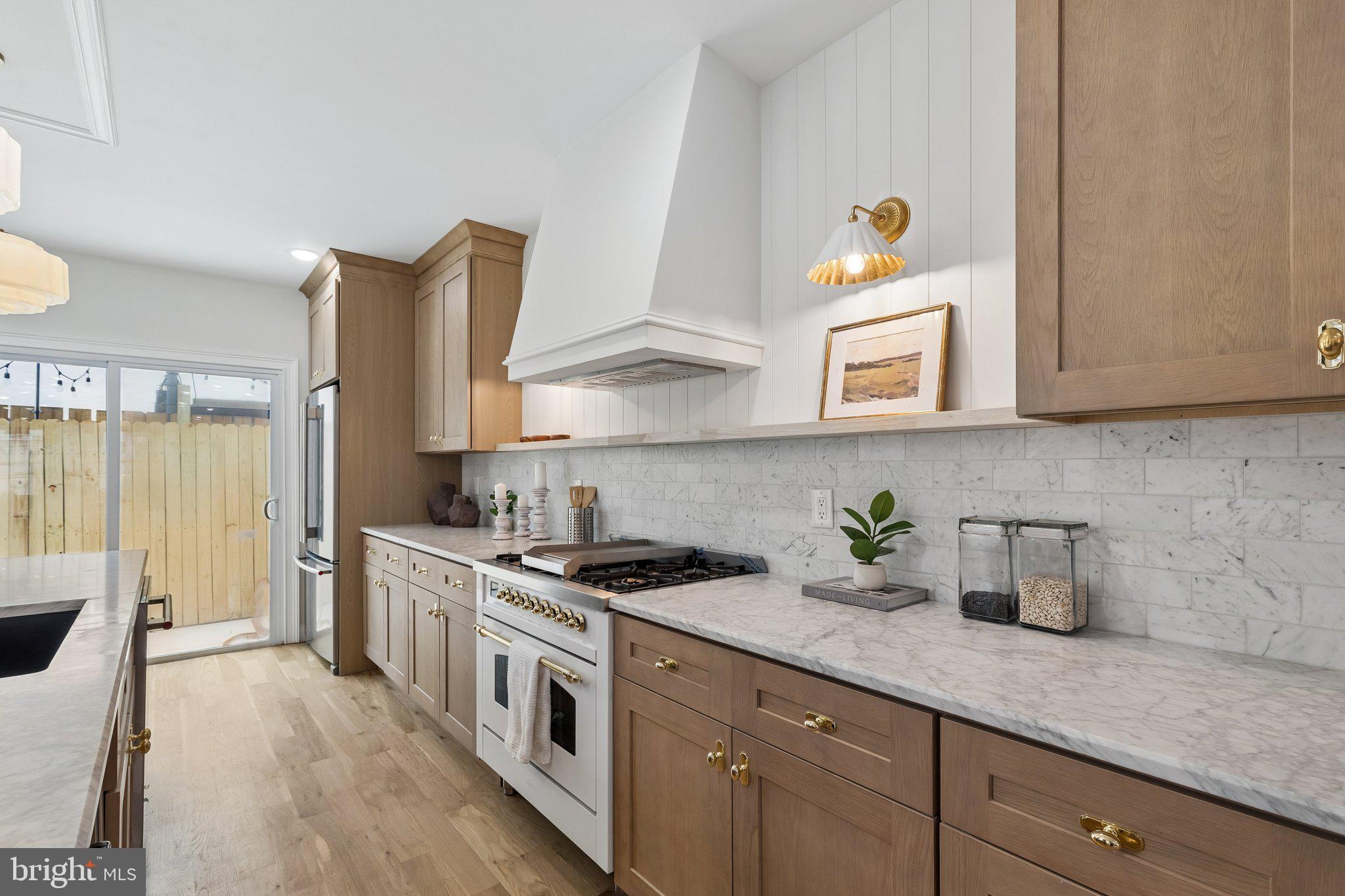 Welcome to 1731 Christian Street, a beautifully crafted residence in the heart of Graduate Hospital, where timeless design meets modern luxury. Thoughtfully designed with exceptional attention to detail, this stunning home showcases premium finishes and custom craftsmanship throughout.

The main living level features wide-plank white oak hardwood flooring, extensive custom millwork, designer lighting, and an open-concept layout ideal for both everyday living and entertaining. At the heart of the home is a chef’s kitchen appointed with custom white oak cabinetry, honed Carrara marble countertops, high-end stainless steel appliances, and abundant workspace for cooking and gathering.
 
The elegant living and dining spaces are complemented by custom wall moldings, sophisticated finishes, and large windows that fill the home with natural light. Every detail has been carefully selected to create a warm yet refined atmosphere.

Retreat to spacious bedrooms offering comfort and style, while the beautifully designed bathrooms feature luxury fixtures, custom vanities, and designer finishes. Throughout the home, the quality of construction and attention to detail are evident in every room.

Perfectly situated on one of Graduate Hospital’s most desirable blocks, 1731 Christian Street offers convenient access to neighborhood restaurants, cafes, parks, shopping, Center City, and major commuting routes. 

A rare opportunity to own a thoughtfully designed home featuring custom white oak cabinetry, honed Carrara marble, premium appliances, and exceptional craftsmanship in one of Philadelphia’s most sought-after neighborhoods.