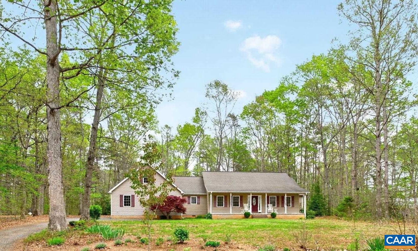 Welcome to your private 2.8 acre retreat in beautiful Gordonsville! Over 2800 SF with 3 BR PLUS bonus room, this well-maintained one-level home offers comfort, space, & peaceful country living. Take your pick of the outdoor living spaces: a full covered front porch, large rear deck, or the screened in porch with a vaulted ceiling overlooking the wooded backyard. Inside, the great room features another vaulted ceiling and a wall of windows onto the porch. Hardwood floors run throughout the main living areas including in the kitchen featuring another vaulted ceiling, quartz countertops, abundant cabinetry, and breakfast bar seating. The split-bedroom design provides added privacy for the owner, and the spacious primary suite features French doors to the rear deck, ensuite bath with his and hers vanities, plus a whirlpool tub. A 13x27 bonus room over the oversized 650 sq ft garage provides flexible space perfect as a game room or movie room. The DIYer will love the detached 16x20 workshop with electricity and wood stove. Located just 2 miles to Rt 15, and only 8 minutes to either Downtown Gordonsville or Downtown Orange.,Oak Cabinets,Quartz Counter