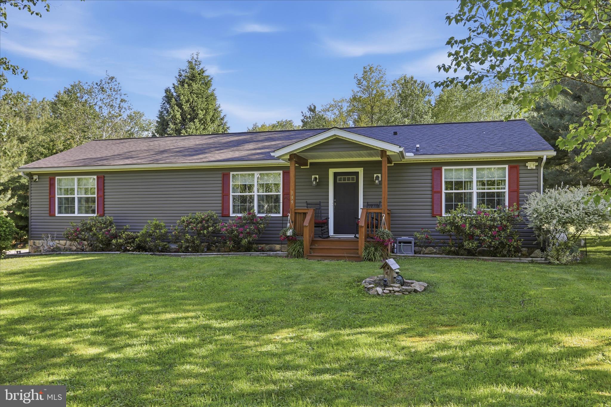 Get ready to meet your safest and easiest living home in your quietest setting ever. Relax on the front or back porch to sounds of only breezes and birds as you gaze at the large lawn and forested area. Take a stroll or a bike/ATV ride on the trail bordering the back of the woods. Head down to the fishing lake exclusive to the HOA, and wave at the friendly neighbors on the way. Enjoy home features specifically designed for easy care, like vinyl siding and high quality roofing. Experience one floor living with lots of storage including a Butler's Pantry and spacious laundry room. Be secure with a complete home fire suppression system as well as a whole house Generac generator. Live rural, yet access shopping, restaurants, bakeries, coffee shops, festivals, etc... with an easy scenic less than 15 minute drive to the quaint towns of Grantsville, Accident, or Friendsville. Another 10 minutes will have you in the Deep Creek Lake and Wisp Ski area. If you want to jump on the state or interstate highway, you'll be in larger towns like Cumberland, MD, Uniontown, PA and Morgantown, WV within 30-45 minutes.  Live large with an open concept home, and oversized two car garage. Luxuriate in the 400+ square feet primary suite with the 48" X 72" tiled shower and separate soaking tub, as well as 8 x 10 walk-in closet. Bring the outdoors in with Hickory Cabinetry, French Doors, and the bright and light space that extra long windows offer you. Be greeted each day with comfort, peace, and ease when this home becomes yours.