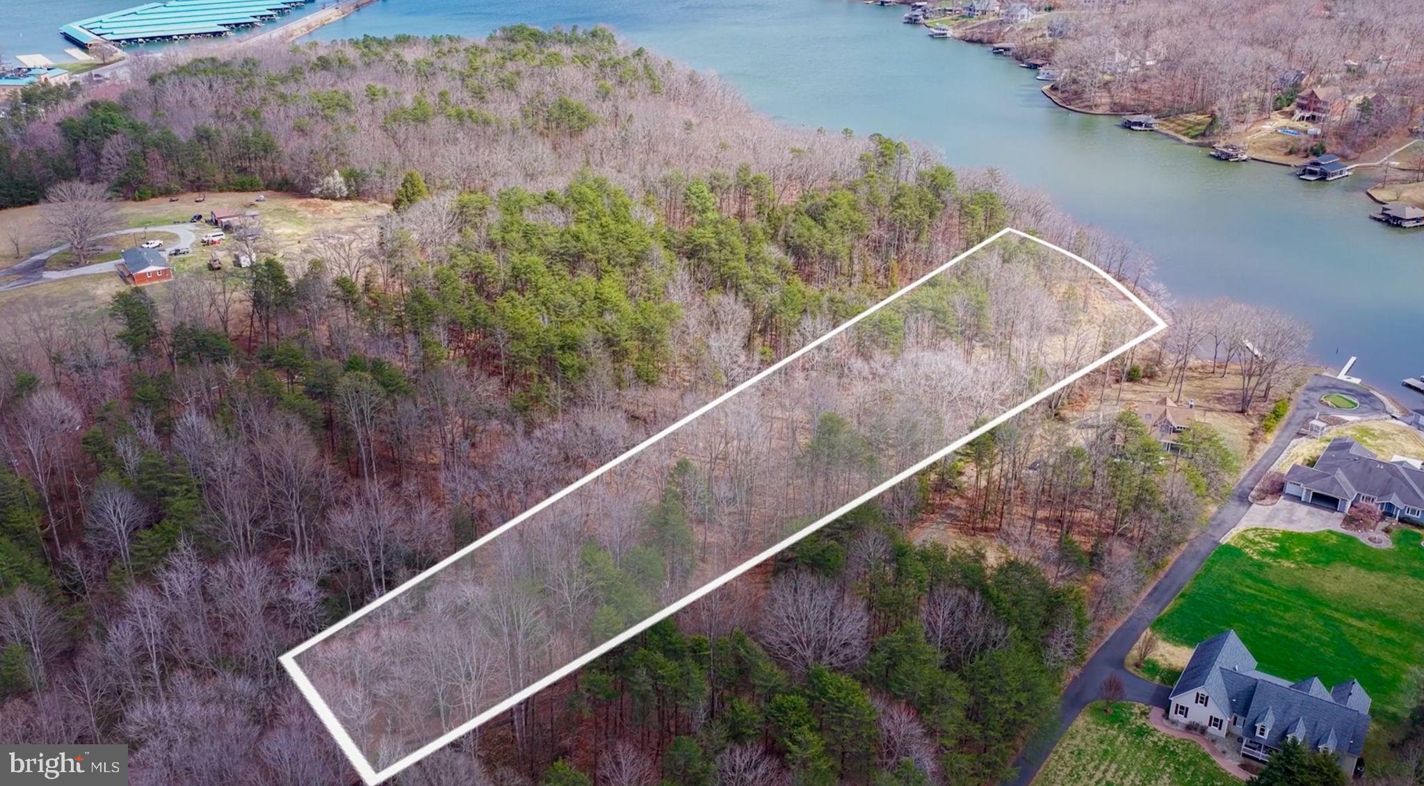 Tucked away on a private 1.5-acre waterfront homesite, this rare offering captures the very essence of lake life on the public side of Lake Anna. A gently sloping approach leads you through a beautifully wooded setting to an open level shoreline—an ideal canvas for creating your perfect waterfront retreat. Imagine designing your dream home to take full advantage of wide, open water views, where mornings begin with coffee on the deck as the sun rises over the lake, and evenings end with unforgettable sunsets reflecting across the water.

With shared waterfront access, you’ll enjoy the benefits of lake living without the restrictions of an HOA—giving you the freedom to build and live exactly how you envision. The property’s natural topography offers both privacy and usability, making it perfect for everything from quiet relaxation to hosting family and friends by the water’s edge.

Ideally located in the heart of Lake Anna’s public side, you’re just minutes from popular marinas, waterfront dining, and all the activities that make this lake such a sought-after destination. Whether it’s boating, fishing, or simply unwinding by the shore, this property offers a lifestyle that feels like a getaway—every single day.

Bring your vision, your builder, and your dreams—this is where your Lake Anna story begins. This could be a great buy and hold investment due to proximity to future high end residential and restaurant development near by.
Be sure to watch the video!
