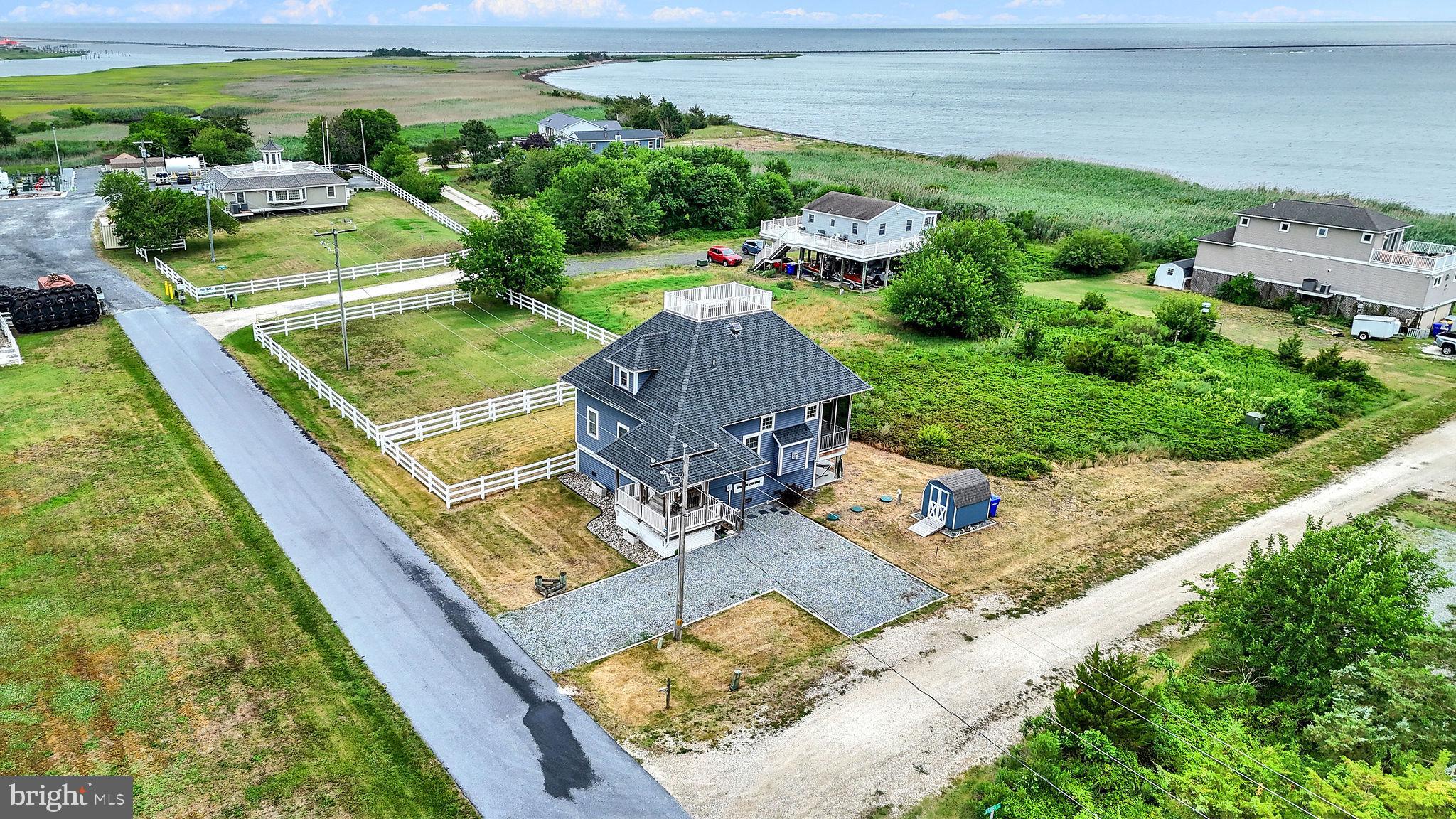 This coastal home with a scenic view of the bay, nature and wildlife has so much to offer! New HVAC system installed in 2024, exterior siding was put on in 2020, new shed in 2025, solar attic fans in 2024.  There are so many ways to view the outdoor surroundings, such as a rooftop deck, screened in back porch, front porch and the primary bedroom balcony.  This home has cathedral vaulted ceilings, a breakfast/dining area, ceiling fans, stainless steel appliances, gas fireplace, a large primary bedroom with double doors to the balcony, primary bath soaking tub and walk in shower and a large closet, the driveway is easy to navigate around, a partially fenced yard and so much more!  Passing septic inspection is available.  The furniture is negotiable. It is located in Slaughter Beach Milford, close to Rt 1 and all DE Beaches.