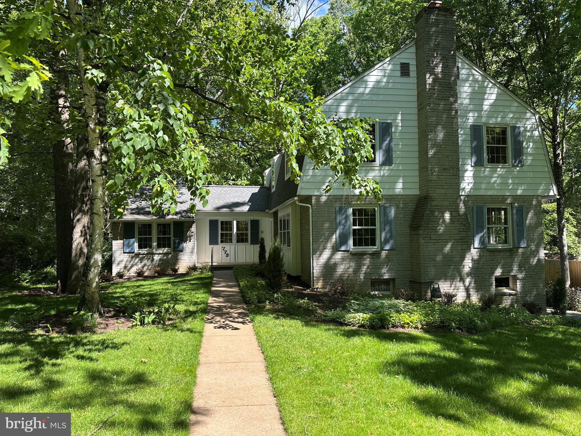 Rare 6-bedroom home in desirable Park Forest Village offering over 2,800 square feet above grade and a flexible layout suited to a range of household needs, including multi-generational living or home office use. A walkout lower level provides additional functional space and potential for future expansion. 
The main level features multiple gathering areas. The living and dining rooms are filled with abundant natural light and share a wood-burning fireplace. A separate family room with a natural gas fireplace opens to a back deck overlooking a peaceful wooded backyard. 
The eat-in kitchen includes custom cherry cabinetry, generous storage, and a practical layout - perfect for everyday living with the option to update to your personal style over time.
A main-level wing with two bedrooms and a full bath lends itself to one-level living, quiet guest rooms, or dedicated remote work space.  
Upstairs, the primary bedroom features a private bath and large walk-in closet. There are three other bedrooms on this floor and a hall bath with dual sinks and a dividing pocket door to offer both convenience and privacy
The walkout lower level provides functional space with a central mudroom/laundry area, finished bonus room/office, and access to the drive-under two-car garage. It also includes a fourth full bathroom and semi-finished areas ideal for storage, hobby,  or workshop use with potential for future conversion to guest quarters.
Newer roof and freshly painted with new carpeting, this home is move-in ready with opportunities to make it your own.
Conveniently located near parks, top-rated schools, shopping, public services, and Penn State University, this home combines a desirable residential setting with comfortable, well-proportioned space and flexibility throughout.