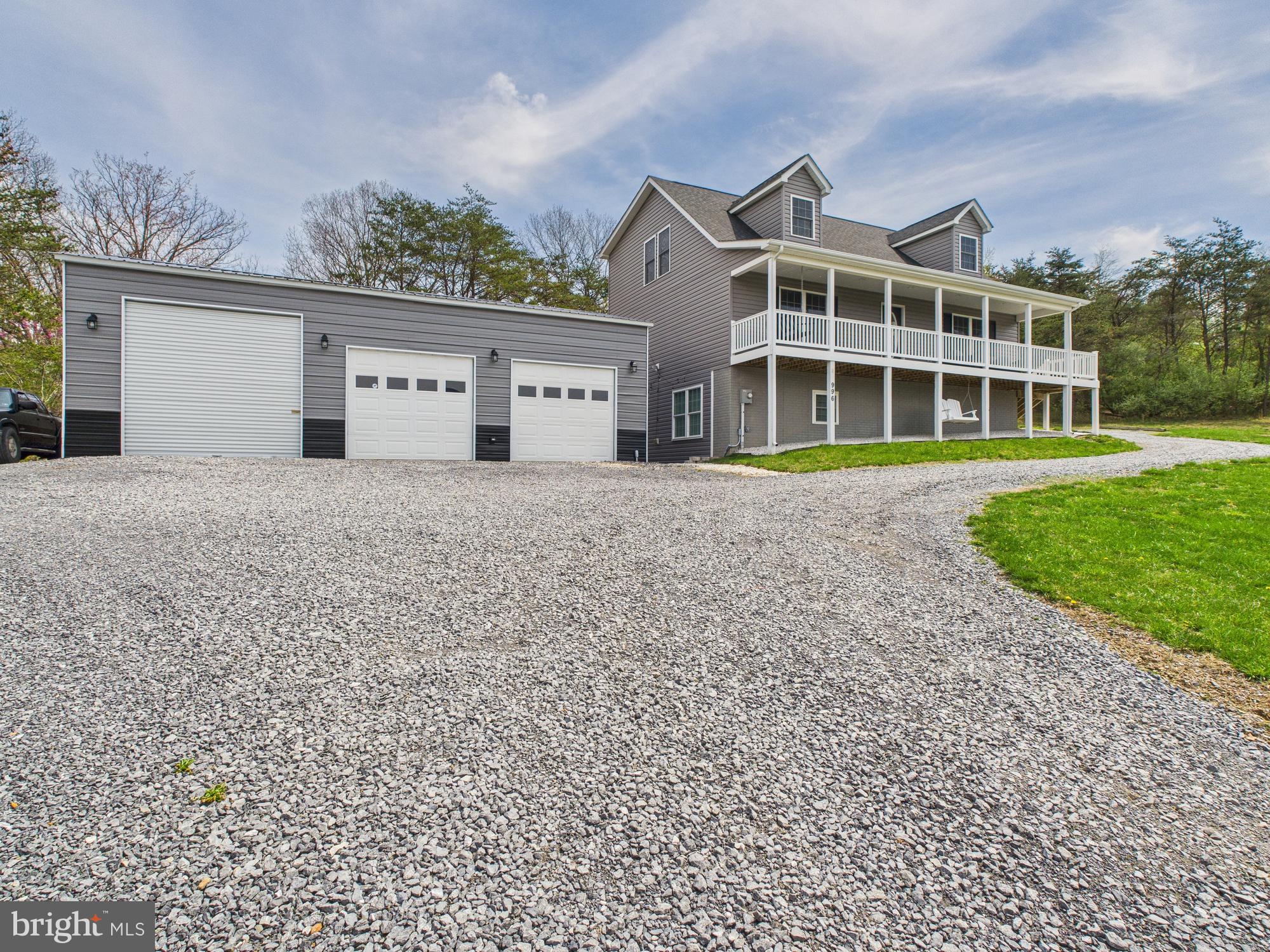 Welcome to your private mountain retreat! This stunning 5 bedroom, 4.5 bath Cape Cod-style home sits on 2.79 beautifully landscaped acres and offers the perfect blend of classic charm and modern convenience.

Inside, you’ll find a spacious and functional layout, featuring a fully finished basement complete with a fully equipped in-law suite—ideal for multi-generational living or hosting extended guests. The main level boasts a bright and airy living space, a well-appointed kitchen, and a cozy dining area perfect for family gatherings. The primary suite, on the main, offers comfort and privacy with a walk-in closet and en-suite bath.

Step outside to take in the breathtaking mountain views that surround the property. Enjoy morning coffee or evening sunsets on the expansive porch, or spend your weekends tinkering in the impressive 25x40 detached garage—perfect for hobbies, storage, or even a home-based business.

Whether you're looking for space to spread out, a place to entertain, or a peaceful escape from the hustle and bustle, this property has it all.