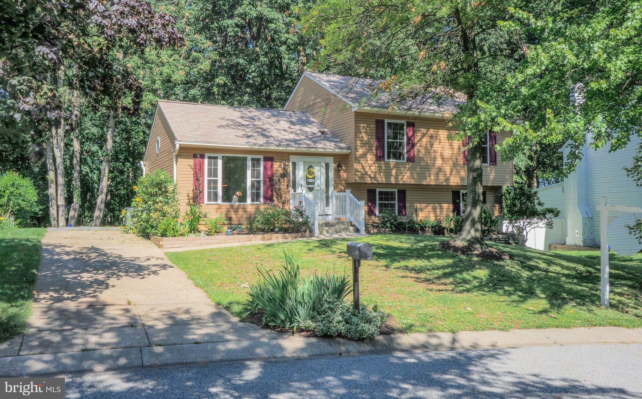 OFFER DEADLINE, 7pm tonight 6/28/2021!  Charming Split Level in a desirable community.  Turn key and worry free!  The kitchen has been tastefully updated with upgraded cabinetry featuring roll out storage shelves, Stainless steel appliances and granite countertops. The main and upper level have Hickory Hardwood Floors throughout with exception to the bathrooms, which are tile.  This home has 4 finished levels!!!  The primary bedroom has an en-suite bathroom and large closets with 4 bifold doors.  There are 2 bonus rooms in the lowest level that could be used as flex space, a home gym, guest room, or home office.  The large deck off the back is perfect for grilling out or entertaining friends and family.  The rear yard is private and backs to woods.  Troy Park, Rockburn Branch, and Harwood Park are nearby featuring basketball courts, playing fields, Bike skills course, tennis courts, playgrounds, etc.  New Windows 2018, New Siding 2019, HVAC 2016,  New Washer and Dryer 2019