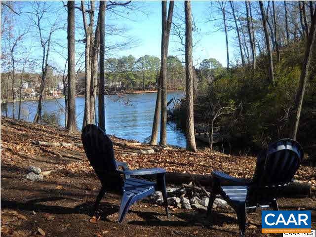 Build your dream home on one of the largest waterfront parcels available on Lake Monticello. Spanning over 1.4 acres, this exceptional homesite offers a gently sloping topography ideal for a variety of home designs, including walk out basements and expansive outdoor living spaces. Tucked along the shoreline this property provides the rare combination of privacy and scale, with ample room to create your owner private retreat. With selective tree cleaning, the lot opens up to reveal truly spectacular water vies, making it easy to imagine sunrise mornings and peaceful evenings overlook the lake. Located just a short drive from Charlottesville. You'll enjoy convenient access to shopping, dining, healthcare and the areas reendowed wineries and outdoor recreation. Within Lake  Monticello community, residents benefit from an impressive array of amenities, including a private lake, beaches, golf course, tennis and basketball courts, clubhouse, and more. Whether you're looking to build ow or invest for the future, this rare waterfront opportunity combines size, setting, and location in one compelling package.,Water front Paradise