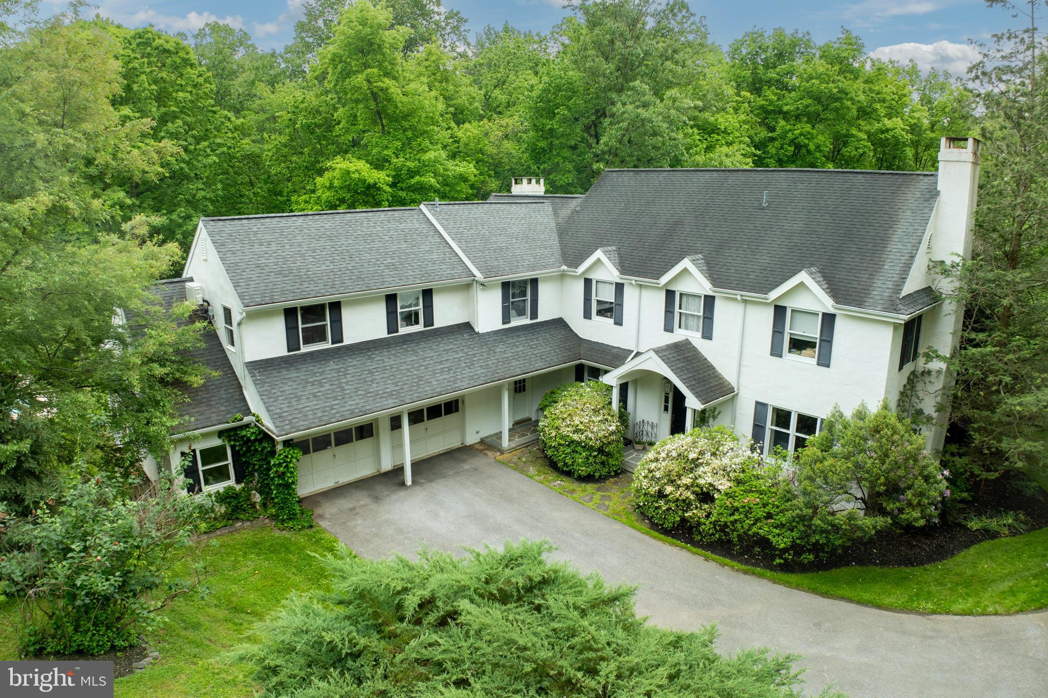 Discover the perfect blend of European charm and traditional elegance in this exquisite, custom built, 4-bedroom property, set on 5.5 lush acres of serene countryside. This home offers a harmonious fusion of classic design and modern luxury, with every detail meticulously crafted for comfort and style.  

Upon entering the main floor, you'll be greeted by a flood of natural light that accentuates the spacious, open living areas, including a living room adorned with a fireplace, an intimate dining room, a family room with an additional fireplace, and a sunroom with peaceful woodland views, creating an inviting atmosphere perfect for both cozy gatherings and grand entertaining. The open kitchen, designed for the culinary enthusiast, flows seamlessly into the dining and living spaces, making it the heart of the home.

Upstairs, the expansive primary bedroom and ensuite bathroom is a retreat unto itself, featuring a massive walk-in closet the size of a large room—perfect for the most discerning fashion enthusiast. An unfinished room above the garage presents endless possibilities, whether you envision a private studio, home gym, or additional living space.

Additionally, the upper level also features three ample-sized bedrooms, along with a versatile bonus room that can be tailored to your needs—whether as a private office, a fifth bedroom, or a cozy retreat.

There's one more surprise on this level—a walk-up attic that provides finishable space and abundant storage, ensuring everything has its place.

The newly renovated, finished basement extends the living area, offering a sophisticated wine cellar, and a large storage area presently including a fully equipped wood workshop.

This exceptional home is thoughtfully angled to face south, with the pitch of the roof designed to maximize the benefits of the sun for both heating and cooling, ensuring energy efficiency year-round. Additionally, the home is equipped with a state-of-the-art geothermal heat pump, providing eco-friendly and cost-effective climate control by harnessing the earth's natural energy. This system further enhances the home’s sustainability while maintaining optimal comfort in every season.

Outdoor living is redefined with a wrap-around deck that invites you to savor bucolic views of the landscaped grounds, including a view of the tranquil pond on the neighboring property that adds a touch of serenity to your surroundings. Multiple entertainment areas provide the perfect backdrop for al fresco dining or leisurely afternoons by the pool. Just a short stroll into the woods, you’ll find a peaceful stream, adding to the natural charm of the property. Additionally, the 3-bay tractor shed offers ample storage for gardening tools and outdoor equipment, ensuring everything you need for maintaining this beautiful property is close at hand.

Whether you’re lounging by the sparkling pool, crafting in your workshop, or enjoying a fine wine from your cellar, this property is designed to cater to your every desire. Experience the timeless elegance and luxurious amenities that make this property an exceptional place to call home.