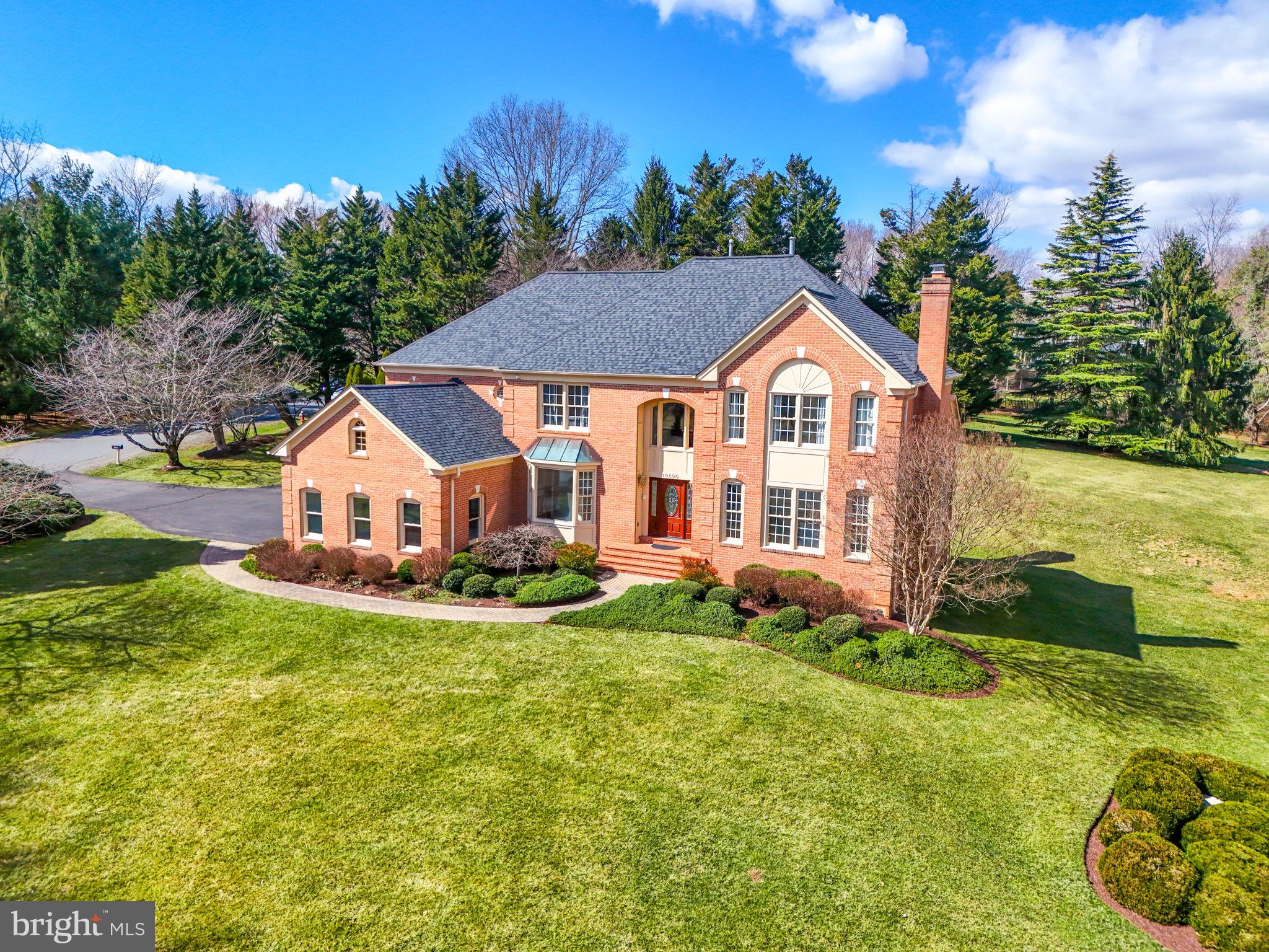 Stunning colonial in sought after Windsong West, beautifully situated on .97 acres. Enter the two story foyer with a sweeping staircase. The top of the line kitchen boasts quartz countertops, large center island, white cabinetry, SubZero Refrigerator, Wolf Stove, a double oven, and features an expansive picture window overlooking the backyard. The two-story family room is a stunning showcase of space and natural light, featuring large windows and a wood burning fireplace. The home provides a separate living room with its own fireplace, a formal dining room, as well as a main level study with glass french doors. Upstairs, discover the primary suite, featuring a relaxing sitting room and generous closet space. The primary bathroom includes a soaking tub, a glass-enclosed shower, and a double-sink vanity. Secondary bedroom features a walk-in closet and an updated, en-suite bathroom. There are two more sizable bedrooms with an updated Jack and Jill bathroom on the upper level. On the lower level walkout, you'll find a new wet bar equipped with a mini fridge and bar seating, creating an ideal space for entertaining. The expansive rec room includes a third fireplace, while additional basement space offers a perfect setting for a workout or game area. Additionally, there is a separate den and a newly completed full bathroom featuring a glass shower. Convenient mudroom and laundry off the three-car garage. In-ground sprinkler system. Refinished hardwoods and new entry hardwood 2025, Updated baths 2025, New lower level bath 2025, Wet Bar 2025, Paint 2025, Kitchen renovation 2023, Roof 2022, Water Heater 2022.