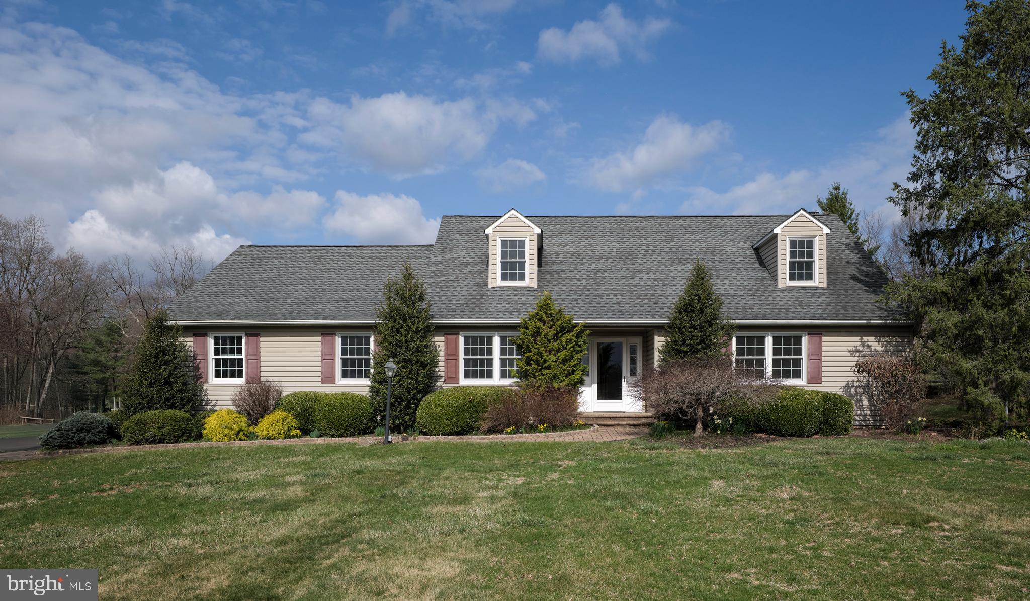Charming Cape in Buckingham Township - Welcome to 4902 Anderson Road. A long driveway leads you to this 4 bedroom, 2.5 bath single-family home in the heart of bucolic Buckingham Township. This beautifully maintained property offers 2720 square feet of living space and sits on a sunny 2.93 acre lot. This center hall entry home features a main floor ensuite with full bath, spacious walk in closet and long distance views. To the left of the entry is your dining room and eat-in kitchen with views of the backyard. The family room overlooks the mature landscape through a large bay window and features a brick gas fireplace with temperature control. An office/craft/play room and first floor laundry (with Bosch appliances) offering access to the rear screened-in porch round out the first level. The second level features another dual vanity full bath with tub/shower combo and 3 generous sized bedrooms all featuring generous walk in closets and one with attic access for extra storage. Enjoy outdoor living at its finest with a generous screened-in back porch that has screens and windows for extended use, fenced, in-ground pool, landscaped garden with stone water feature and lots of flowering bushes and mature trees. There is also a large garden shed and a fenced garden for the gardening enthusiast. An ideal backyard retreat! This home has a full basement with Bilco doors to the backyard and a two-car garage featuring an epoxy sealed floor. Set across from rolling Bucks County farmlands and centrally located between Doylestown and New Hope this home is located in the Central Bucks School District.  Don’t miss the opportunity to make it yours!