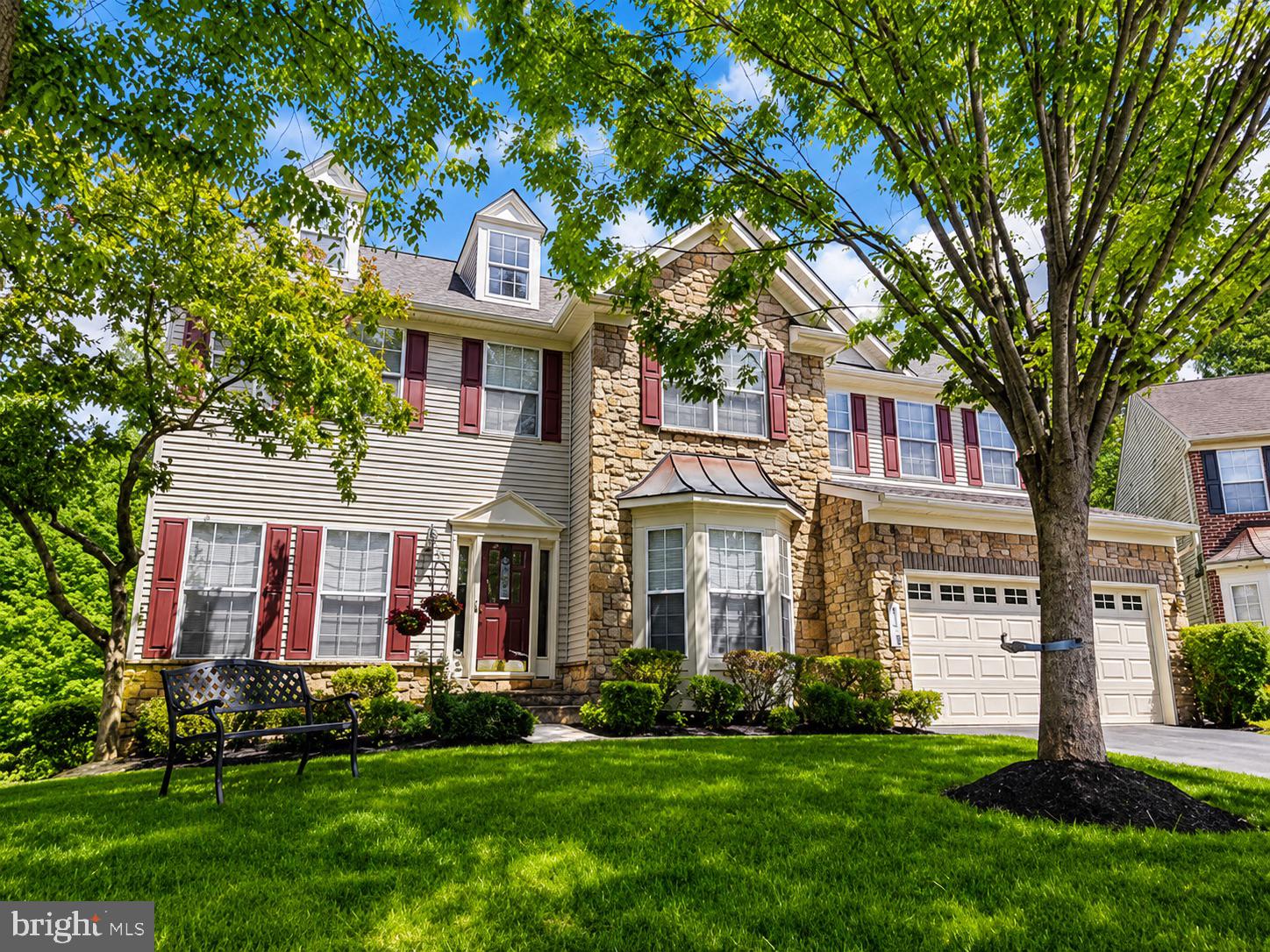 Welcome to this beautifully maintained stone-front residence offering an exceptional blend of elegance, comfort, and functionality in Ellicott City. Thoughtfully designed with spacious living areas and timeless finishes, this home features gleaming hardwood floors, extensive moldings, abundant natural light, and a flowing floor plan ideal for both everyday living and entertaining. The gourmet kitchen serves as the heart of the home with granite countertops, stainless steel appliances, abundant cabinetry, a large center island, and generous workspace, opening seamlessly to the adjacent living areas. Formal living and dining spaces provide refined gathering areas, while the upper level offers generously sized bedrooms and flexible spaces to accommodate a variety of lifestyle needs. The finished lower level expands the living space with a large recreation area, fitness or hobby space, additional storage, and endless possibilities for relaxation and entertainment. Outside, enjoy an expansive composite deck overlooking the Patapsco State Park and a peaceful natural backdrop, creating the perfect setting for outdoor dining, gatherings, or quiet evenings at home. Additional highlights include an attached garage, beautifully landscaped grounds, ample storage throughout, and meticulous pride of ownership. Conveniently located near shopping, dining, parks, recreation, and major commuter routes, this exceptional property offers the perfect combination of space, style, and convenience. Schedule your private tour today and experience all this remarkable home has to offer.