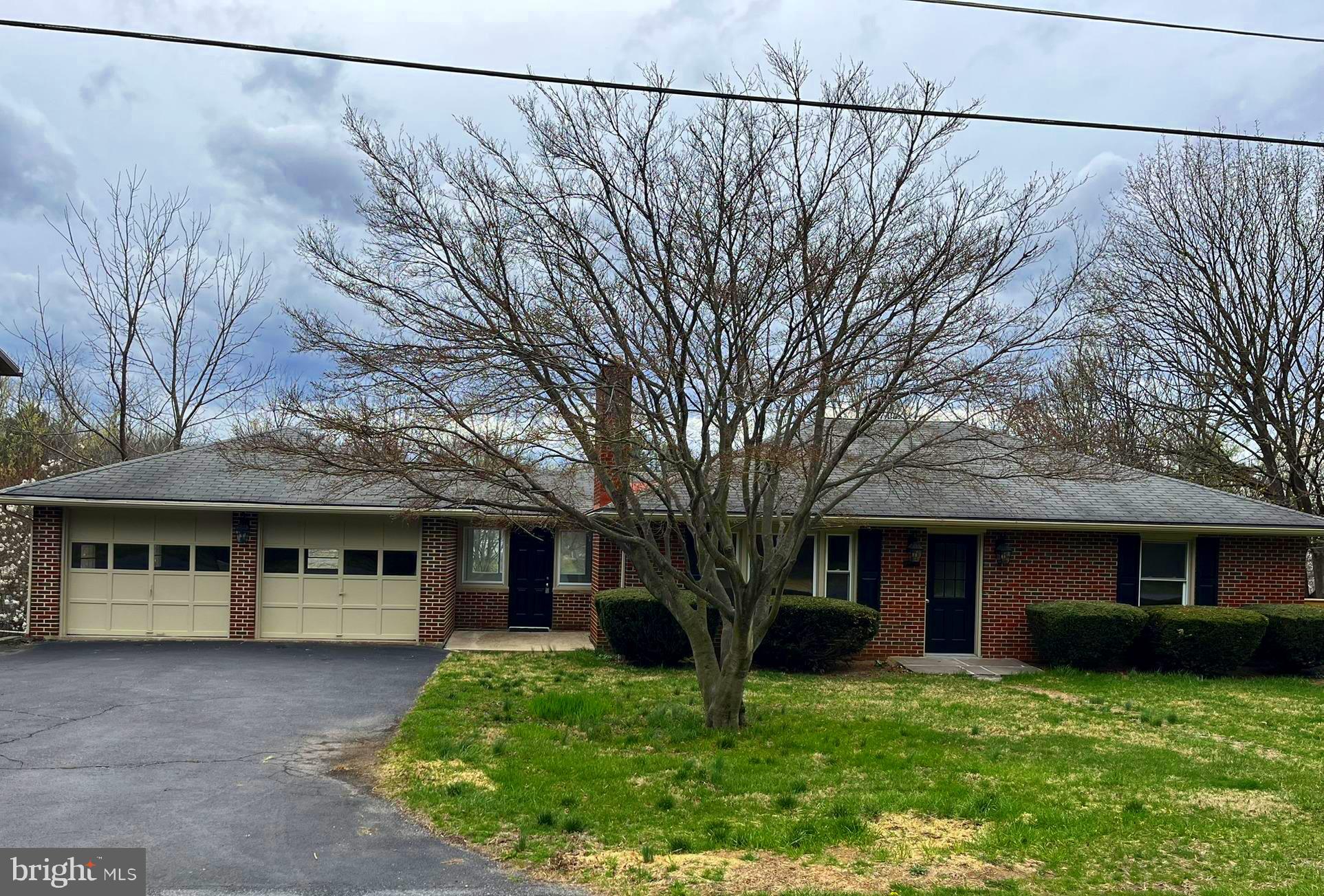 Welcome Home! Picture yourself in this beautiful, fully renovated brick rancher with loads of space! Conveniently located close  to Meritus Medical Center, HCC, access to Route 70, shopping and restaurants. This home boasts plenty of natural light throughout.  The living room has a brick fireplace for cozy nights at home.  The kitchen has brand-new stainless-steel appliances, quartz countertops and a timeless backsplash. Enjoy your morning coffee in the finished sunroom off the kitchen with decorative tile flooring and a view of the backyard.  Refinished hardwood floors throughout the main level and new fixtures throughout the home!  Head downstairs to a very spacious finished lower level, complete with a sizeable laundry room, another full bath, and a bonus room that can be a 4th bedroom or an office!  You will be welcomed by a very large family/rec room with recessed lighting for entertaining!  Another special aspect is the massive workshop area, which may also be used for extra storage as well.   Additionally, there is a very large 2 car garage and large back yard!  Come see for yourself!  Note: (2 entry doors Main level and 2 doors on lower level - stairs from front yard to back yard on side of house).