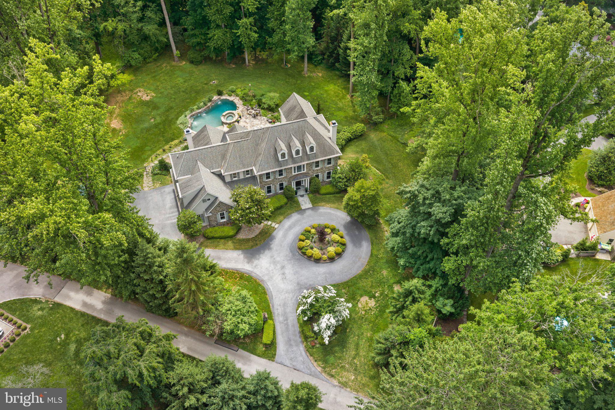 Set along a private drive in the heart of the Main Line, this exceptional Halesworth model by Lee Haller offers a rare blend of timeless craftsmanship, modern upgrades, and resort style living. With 6 bedrooms and 5 full and 2 half baths, this home is designed to feel both expansive and intimate, delivering a true sense of retreat just moments from everything the Main Line has to offer.

From the moment you arrive, the setting feels like a hidden oasis. Surrounded by mature landscaping and thoughtfully cleared grounds, the property offers unmatched privacy and serenity. The backyard is a destination in itself, featuring a sparkling pool and hot tub, perfect for quiet mornings, summer entertaining, or unwinding at the end of the day.

Inside, the home has been extensively refreshed with a refined, neutral palette and elevated finishes throughout. Sunlight fills each space, highlighting detailed millwork, updated trim, and beautifully reimagined interiors. The second level has been enhanced with rich hardwood flooring, while both the main and secondary staircases have been upgraded with elegant oak risers, adding continuity and sophistication across levels.

The home’s infrastructure has been equally elevated, offering peace of mind and modern convenience. A comprehensive whole-home water treatment system with carbon filtration, softening, and UV purification ensures exceptional water quality, complemented by a new well pressure tank and sump pump system.

Every detail has been considered to enhance both form and function, from newly installed appliances including a Maytag front load washer and dryer to extensive exterior improvements that open up the landscape and maximize usable space.

Beyond the home, the location is equally compelling. Situated within the award-winning Tredyffrin-Easttown School District, this property offers convenient access to some of the Main Line’s most sought-after destinations. Enjoy nearby dining at White Dog Cafe, Terrain Cafe, and Autograph Brasserie, or explore upscale shopping at King of Prussia Mall and Suburban Square. Everyday essentials are just minutes away with Whole Foods, Trader Joe’s, and Wegmans all within easy reach.

For commuters and those on the move, the home provides seamless access to Routes 476, 76, and the Pennsylvania Turnpike, along with nearby SEPTA regional rail stations offering direct service to Center City Philadelphia. Outdoor enthusiasts will appreciate proximity to the Radnor Trail, Jenkins Arboretum, and Valley Forge National Historical Park, offering miles of scenic walking trails and green space.

This is more than a home, it is a private retreat designed for elevated everyday living, where luxury, comfort, and convenience come together in one of the Main Line’s most desirable settings. Full stucco remediation completed June 2026. New Hot Water Heater. New HVAC unit.