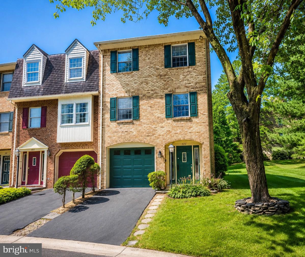 Meticulously maintained all-brick end-unit townhome in North Gate! This move-in ready home offers 2 bedrooms, 2 full baths, 2 half baths, and a large fully fenced backyard.

The entry level features a spacious family room with a natural gas fireplace and half bath, offering flexible space for a home office, recreation room, or potential third bedroom. Step outside to a covered brick patio and enjoy the privacy and space of the backyard.

The main level boasts hardwood floors, a large living room with a second natural gas fireplace, a half bath, and an updated eat-in kitchen with Silestone countertops, slate GE appliances, and natural gas cooking. The kitchen opens to a rear deck with an electric SunSetter awning, perfect for relaxing outdoors.

Upstairs, you'll find a spacious primary suite with vaulted ceilings, a walk-in closet, and a private bath with a skylight, along with a large second bedroom, its own full bath, and a conveniently located laundry area.

Additional features include central air, natural gas heat, a one-car garage, and ample storage space. North Gate residents enjoy a community pool, playground, walking paths, lawn maintenance, and snow removal, all conveniently located near shopping, dining, schools, I-70, and I-81.

A wonderful opportunity to enjoy low-maintenance living in one of the area's most desirable communities.