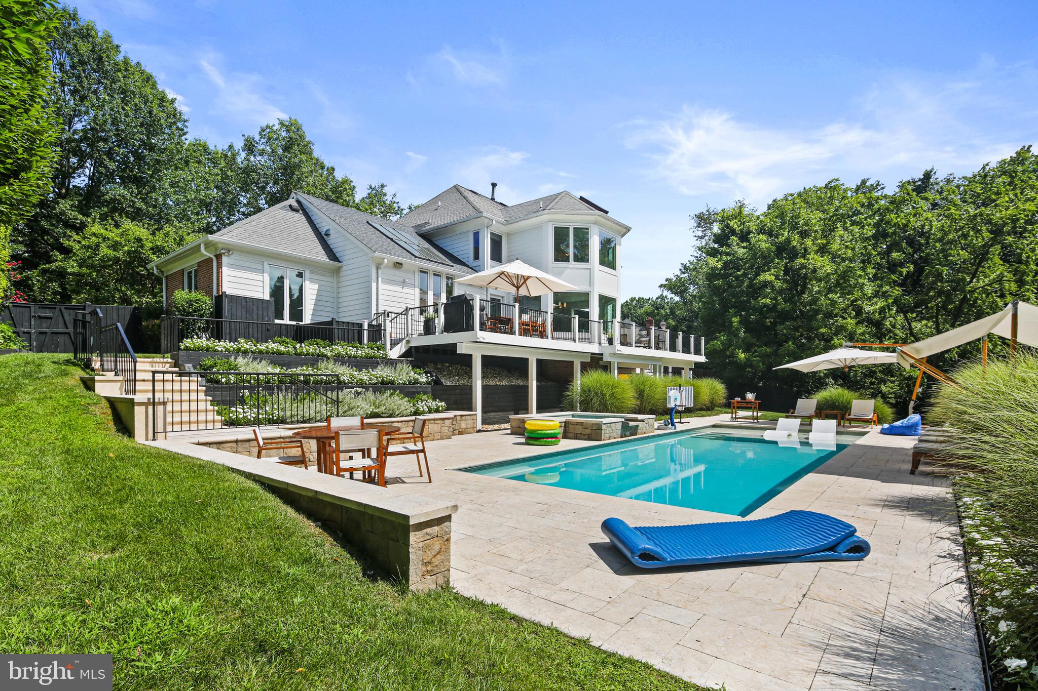 Be sure to see VIRTUAL TOUR for a 3D tour of the home!
Discover resort-style living in this exceptional five-bedroom, four-and-a-half-bathroom home nestled in the prestigious Kentsdale Estate section of Potomac. This newly listed property offers an ideal blend of comfort and sophistication, perfect for families seeking both luxury and functionality in one of Maryland's most desirable neighborhoods.
Completely re-designed and renovated in 2015, this is a custom home with high end finishes similar to a resort. The thoughtfully designed layout features five spacious bedrooms, including a stunning primary bedroom that serves as a private retreat. Each of the four full bathrooms, as well as the half-bath, showcases quality finishes. The home's redesigned configuration creates an open floor plan from the kitchen, with 2 white Carrera marble islands, to the dining area and beyond to the family room. 
Step inside to experience the resort-style atmosphere that defines this remarkable property. The interior spaces are crafted with attention to detail, offering comfortable living areas that seamlessly blend relaxation with elegance. Large windows throughout the home invite natural light, creating bright and welcoming environments in every room. The step out to an expansive deck, with enough room for a 10-seat dining table. The expansive deck overlooks the pool, spa and gardens.
The location provides exceptional access to some of the area's finest recreational opportunities. Nature enthusiasts will appreciate the proximity to Locust Grove Nature Center, offering peaceful trails and educational programs just minutes away. Families can enjoy outdoor adventures at nearby Cabin John Regional Park, featuring playgrounds, sports facilities, and scenic walking paths. For those seeking more extensive outdoor experiences, the renowned Great Falls Park provides breathtaking waterfall views and challenging hiking trails.
The Potomac location offers the perfect balance of suburban tranquility and metropolitan convenience. Residents enjoy access to highly-rated schools, upscale shopping destinations, and diverse dining options. The community's tree-lined streets and well-maintained neighborhoods create an atmosphere of refined living while maintaining easy access to major commuting routes.
This property represents an outstanding opportunity to join one of the region's most sought-after communities. The combination of resort-style amenities, thoughtful design, and prime location creates an exceptional living experience. Whether you're looking for a peaceful retreat or an active lifestyle surrounded by natural beauty and cultural attractions, this custom re-designed home delivers on every level. The five-bedroom layout provides flexibility for growing families, home offices, or guest accommodations, ensuring the space adapts to your changing needs over time.