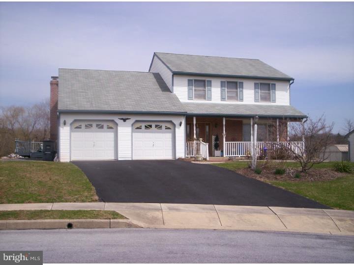 Court setting with nice lot.  Has central air, gas heat and extra large basement with exit.  Incredible first floor family room with brick fire place, patio doors to two tiered deck.  Do painting and new carpeting and you will have a great home.  Close to shopping and family needs.