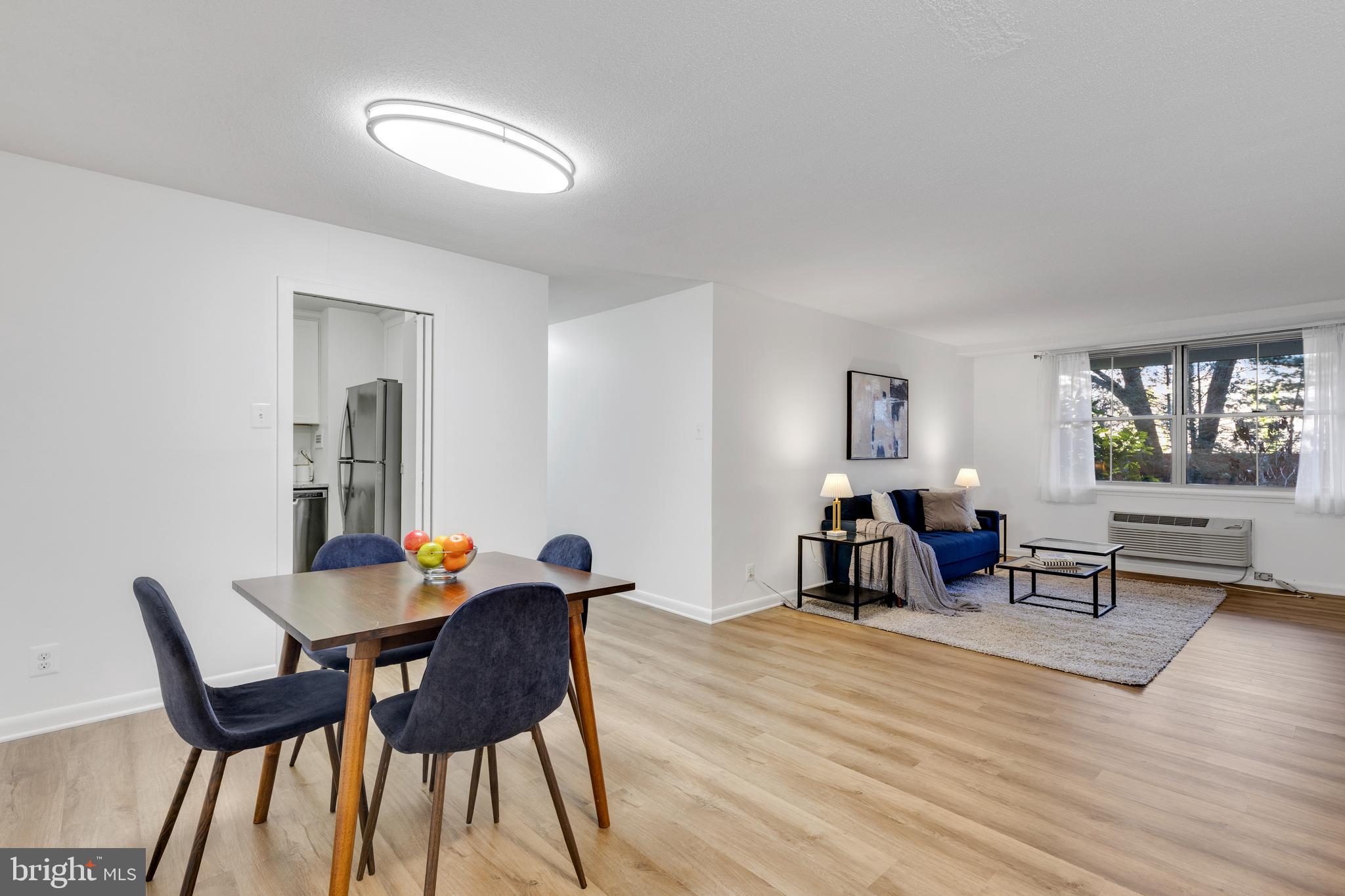 Price Improvement - Incredible Value with ALL Utilities Included! Simplify your monthly expenses at Circle Condominium in North Arlington - the condo fee includes ALL utilities (electricity, gas, water, heating, and cooling), making this a true all-in payment with no surprise bills.

This beautifully updated 2-bedroom, 1.5-bath ground-floor home offers a fresh, modern feel with new LVP flooring & fresh paint throughout. The light-filled living room overlooks peaceful greenspace, creating a quiet retreat in the heart of Arlington. The dedicated dining area flows seamlessly from the living space and is highlighted by a modern light fixture. The updated kitchen features crisp white cabinetry, granite countertops, & stainless steel appliances - stylish, functional, and ready for everyday living. Down the hall, you’ll find excellent storage with multiple closets, including a linen closet. The 2nd bedroom offers a double closet, while the primary suite includes a walk-in closet & a private en-suite powder room. The hall bath has been tastefully renovated with tile flooring, a tiled shower, & a stone-topped vanity. A newly replaced electrical panel (2025) adds additional peace of mind. One assigned parking space (#113) conveys.

Circle Condominium offers exceptional amenities: a community pool, rooftop terrace with sweeping DC views, BBQ areas with picnic tables and grills, a community room, bike storage, laundry facilities, onsite management, & ample visitor parking. The community is known for its quiet, well-maintained setting. Ideally located near the Custis Trail, Courthouse shops and restaurants, & the Metro, with easy access to Reagan National Airport, the Pentagon, Alexandria, and DC.