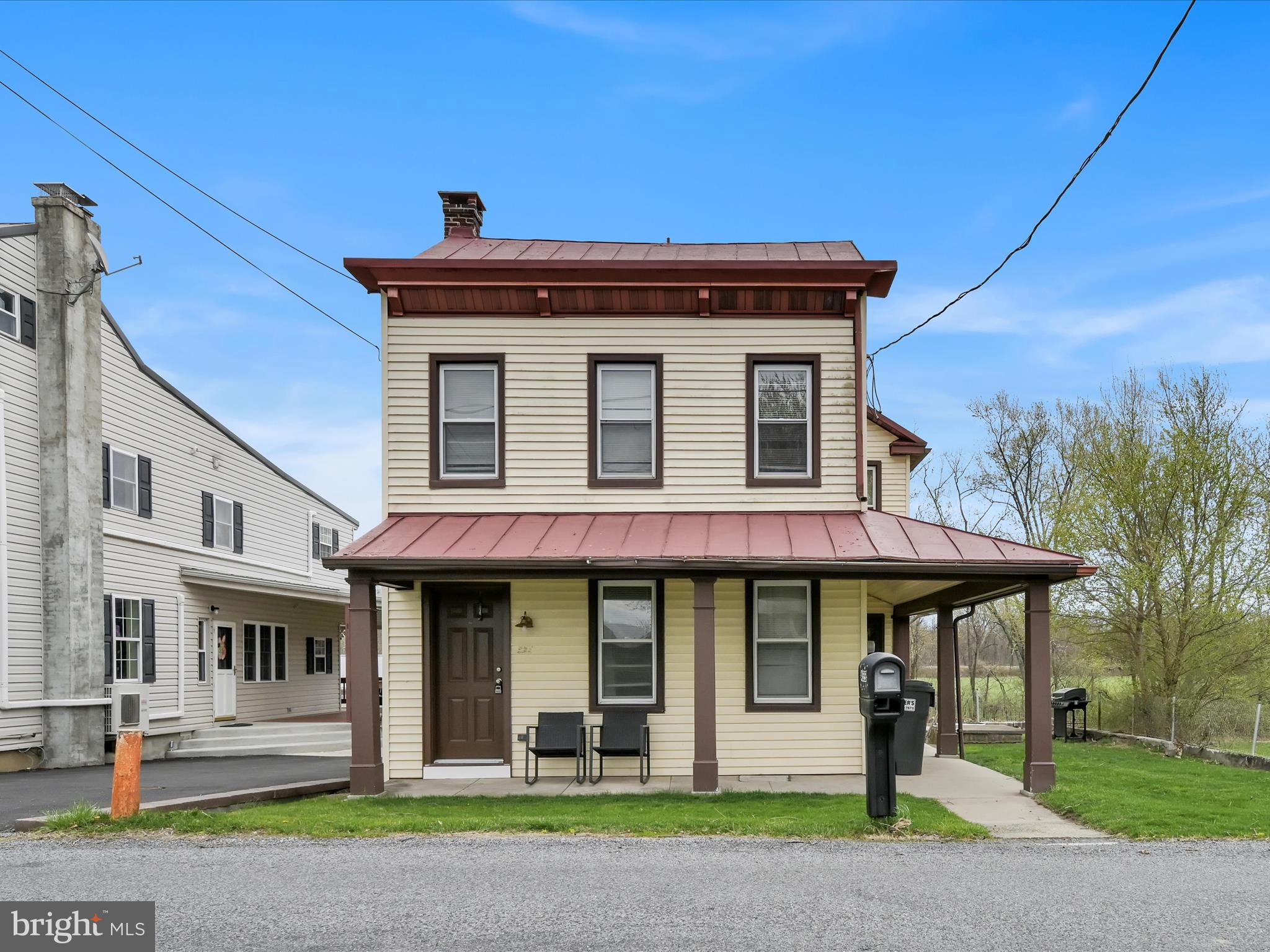 ​Nestled in the tranquil countryside of Tilden Township, 455 Berne Road in Hamburg, PA, is a charming 3-bedroom, 2-bathroom farmhouse-style home offering 1,680 square feet of living space. Built in 1900, this residence has modern updates, with its spacious first floor, eat-in kitchen, and wraparound porch perfect for enjoying serene views of the adjacent stream and open fields. The property includes a two-car detached garage located across the street, providing ample storage and parking. Interior features such as wood and vinyl flooring, ceiling fans, and replacement windows enhance comfort and functionality. Set on a 0.21-acre lot with well and septic systems, this home offers a peaceful rural lifestyle while remaining within the Hamburg Area School District. Whether you're seeking a quiet retreat or a character-filled residence, this property presents a unique opportunity to embrace country living. Schedule your private showing today.