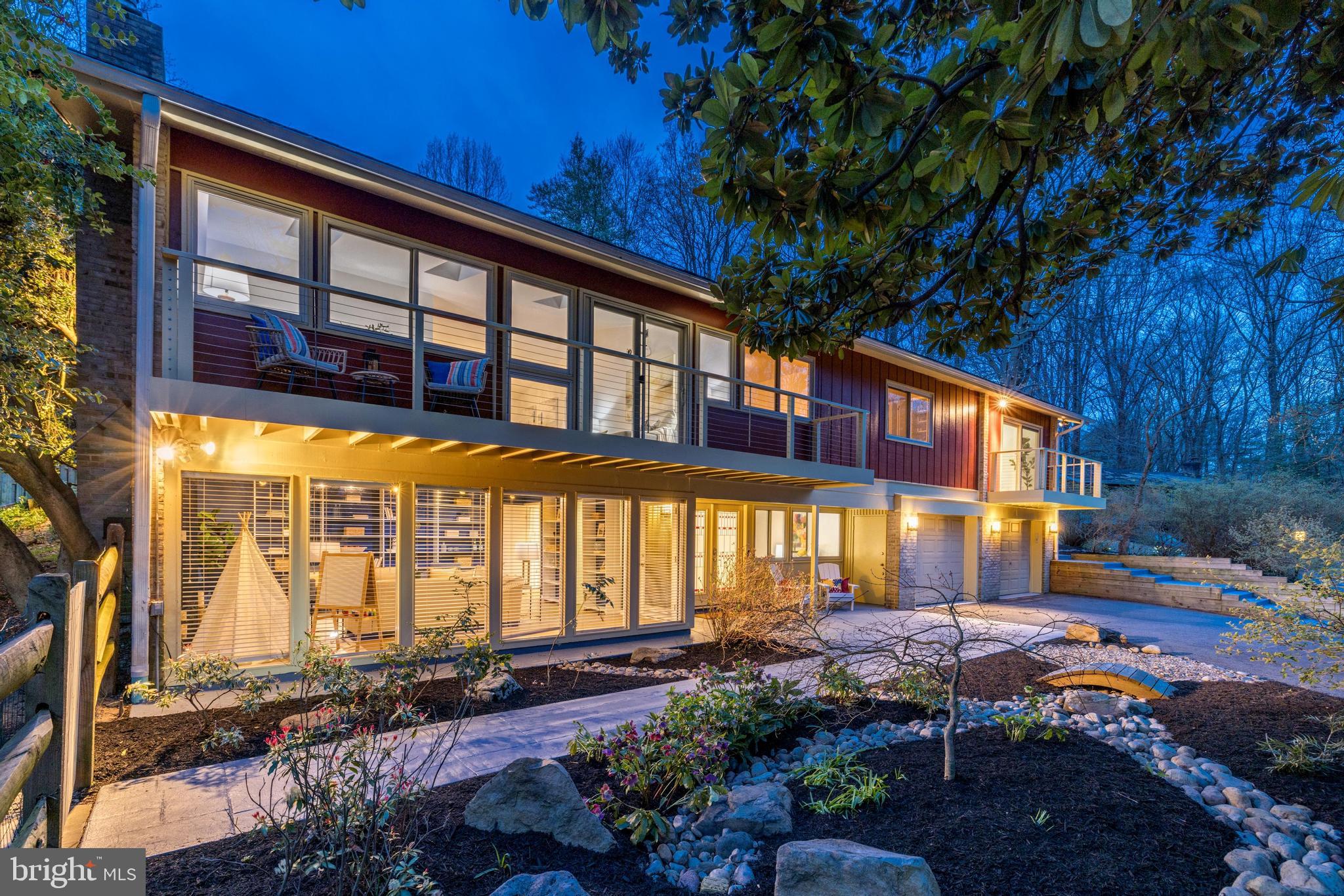 Mid-Century Modern Charm Meets Modern Luxury! Welcome  to 8042 Park Overlook Drive, a true beauty that seamlessly blends indoor and outdoor living on a 1/2 acre lot!  This expanded 4 bed, 3 ½ bath Overlook model home is nestled at the peak of a cul-de-sac on one of the best lots in the sought after Carderock Springs community in Bethesda. The stunning home boasts a private and expansive yard where you’ll see lush foliage and an impressive row of pink blooming azaleas. A true private oasis.

As you ascend the stairs to the main level, prepare to be captivated with an open-concept floor plan consisting of two entertaining spaces connected by the dining room creating a seamless flow between spaces. This level has beautiful hardwood floors, an elegant gas fireplace, vaulted ceilings, numerous skylights, and wonderful oversized windows creating amazing natural light. Sliding glass doors on the front side of the house open to a balcony where you can enjoy having coffee while looking out onto the neighborhood. A wall of windows and sliding glass doors on the back side of the house open to a large wooden deck and showcase the expansive and tranquil private backyard oasis. The renovated kitchen features Caesarstone countertops, all new stainless-steel appliances, beautiful cabinets, including textured glass cabinets with warm LED lighting adding a touch of elegance creating a warm ambient mood.

Venture down the hall to find the expanded primary suite awaiting with custom closets, skylights, sliding glass doors that lead to a balcony on the front of the house, a cozy lounging area with large windows that frame the serene backyard and a large ensuite primary bath. Upon entering the spa-like primary bath, renovated in 2022, you’ll find a luxurious retreat, featuring exquisite, tiled floors, heated towel racks, a wet room with a double shower, a water closet with a Toto bidet, and an exquisite soaking tub. Two additional bedrooms and a stylish hall bath renovated in 2024 complete this level.

Descending to the lower level, stop by the charming powder room conveniently built on the landing between both floors. On the lower level you’ll find a large family room with a gas burning fireplace, a wall of windows that overlook the Japanese inspired garden, and a wall of built-in bookshelves. Make sure to check out the delightful secret area, cleverly tucked behind a sliding row of bookshelves, adding a touch of whimsy to the space. This level also features a fourth bedroom, large laundry room and another stunning bathroom renovated in 2024.

Notable features of the home include new Pella windows and sliding doors throughout, a projector and screen with surround speakers, an oversized two-car climate-controlled garage with ample storage space, a cedar-walled shed in the backyard, two additional parking areas in the cul-de-sac, and a new luxury vinyl flooring on the lower level.

Within the vibrant community of Carderock Springs, residents enjoy access to the Carderock Springs Swim and Tennis Club, proximity to the Bethesda Co-op, and a variety of dining options on Macarthur Boulevard. Additionally, the home is conveniently located near Potomac Village, offering the perfect blend of convenience and charm. Moreover, the neighborhood's inclusion in the National Historic Registry underscores its timeless appeal while covenants, an architectural board, and a tree committee contribute to the preservation of its unique character and natural beauty.