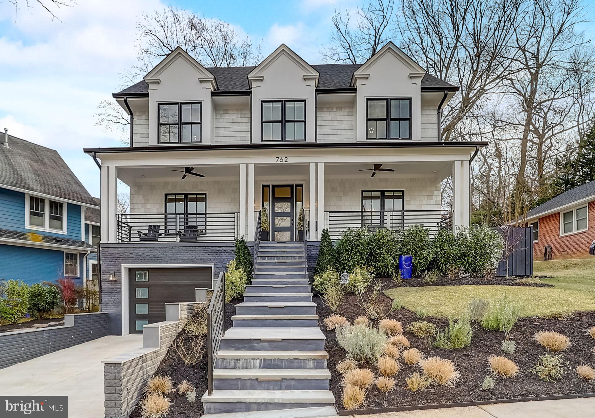 Step into this pristine home nestled in the picturesque Aurora Heights neighborhood. As you wander through its inviting spaces, envision the countless moments of joy and contentment that could unfold within these walls. Originally built in 2022, this home went through a total overhaul, shedding its old identity to reappear in a fresh new form. From the ground up, every detail has been meticulously crafted, with a fresh foundation serving as the canvas for a modern masterpiece. No vestige of the previous home remains, as state-of-the-art HVAC, plumbing, electric systems, insulation, and drywall now grace its interior. Indulge in the luxuries often overlooked by standard builders, as this residence boasts a plethora of upgrades. Five bedrooms, exercise/bonus room, four full baths, and two half baths provide ample space for comfortable living, while high-end Thermador appliances and Quartz countertops elevate the kitchen to gourmet status. Designer lighting, carefully curated tile, and fixtures add a touch of elegance to every room. Outside, discover your private oasis, complete with an attached garage, abundant storage, and a charming back patio ideal for basking in the morning sun. Enjoy evenings on the expansive front porch, savoring the sunset with a glass of wine in hand. The spacious backyard is perfect for entertaining and beckons with a fire pit, offering the perfect setting for storytelling on crisp nights. Conveniently located in a prime location, mere minutes from DCA, Washington D.C., the Amazon HQ, and a myriad of shops and restaurants. Don't let this opportunity slip away—schedule your viewing today and step into the epitome of modern living.