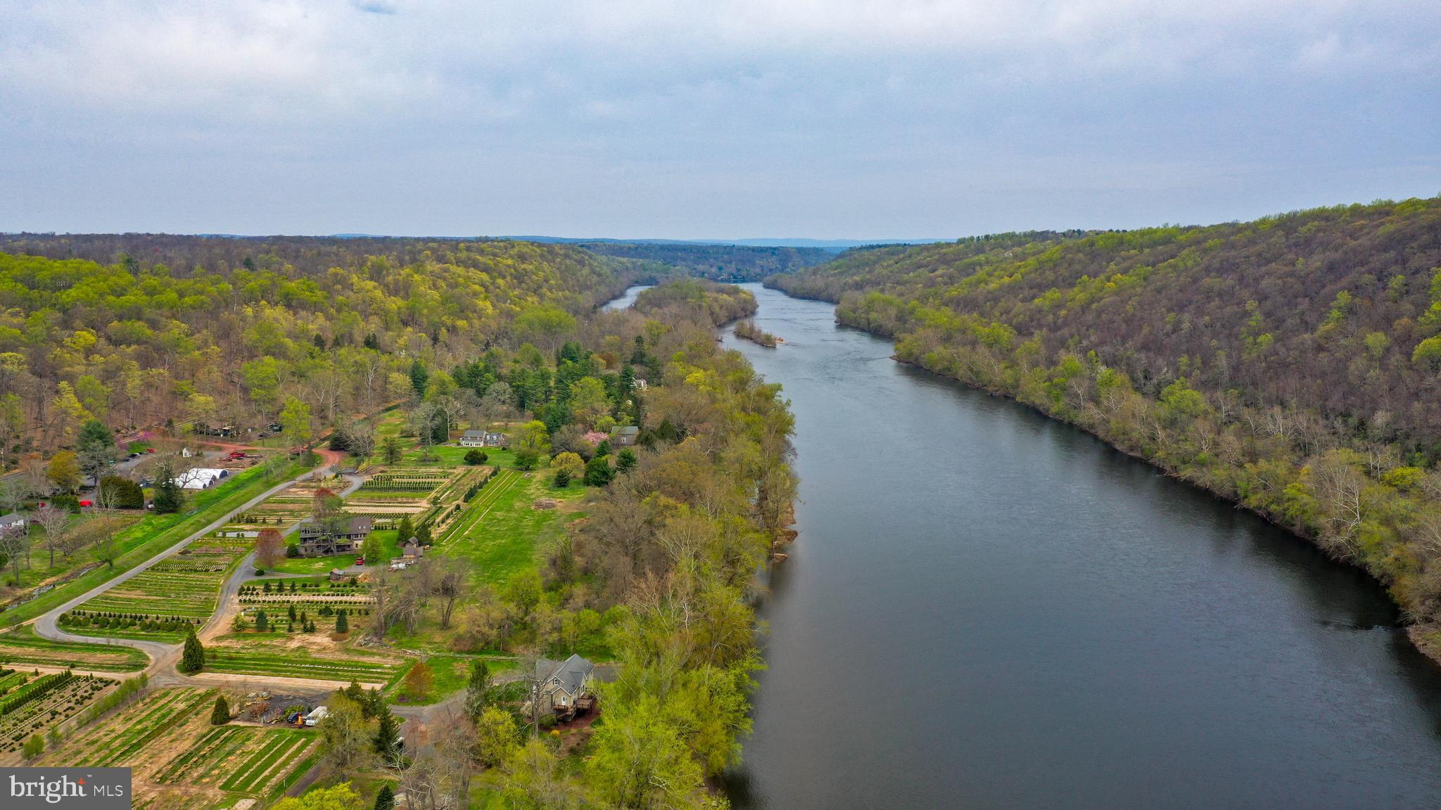 ON THE DELAWARE RIVER CANAL...Discover a rare slice of
pastoral perfection, far from the flood zone but moments from

adventure. This meticulously updated home offers an idyllic, farm-
like retreat with the Delaware River towpath and canal at your

doorstep, ready for strolls to local culinary delights or bike trips to
the bustling arts communities of Frenchtown and New Hope.
Imagine summer days lounging by your private salt-water pool
and pool house, or picking fresh fruit from your own mini orchard.
An all-new (2024) garage with an artist’s studio provides a
dedicated space for an office and creative pursuits. The home’s
modern comforts, including a full-house generator and a specially
designed dog room with a heated floor and doggie door, make
this home a sanctuary for every member of the family. Actually, it’s
more than a home - it's a lifestyle.
Turnkey and immaculate, the home is move-in ready with
high-quality finishes and fabulous charm. There is an electric gate
with generator back-up providing security and uninterrupted
access. Stunning metal roofs add character at first approach.
Updated and enhanced with love and care, the home offers two
wood burning stoves, multi-zoned heating and cooling and a first
floor office that could easily be a future bedroom. The new Elmira
Period kitchen appliances add a touch of vintage charm with
modern functionality. With all the charm of a Bucks County Inn,
there are 4 bedrooms and three baths. But it is the cozy third
floor bedroom, tucked under the eaves, that will have guests and
children vying for their space.
Outside, an established orchard features a variety of fruit
trees (peaches, pears, plums, apples, and sour cherries), a
garden and a fenced yard. Relax and enjoy the sounds and
sights of this very special back yard oasis, nestled in a Bucks
County river town, beckoning weekend adventures with family
and friends.