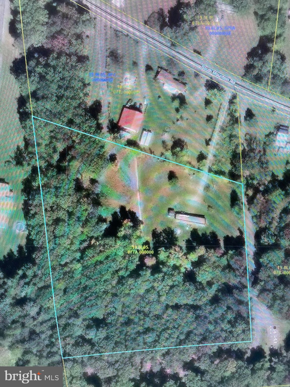 Almost 5 acres with well and sand mound! Mobile home on property conveys but is being sold "as is".  Please use caution when showing.  Property has electric and could even be sub-divided as it has a separate ingress and egress.