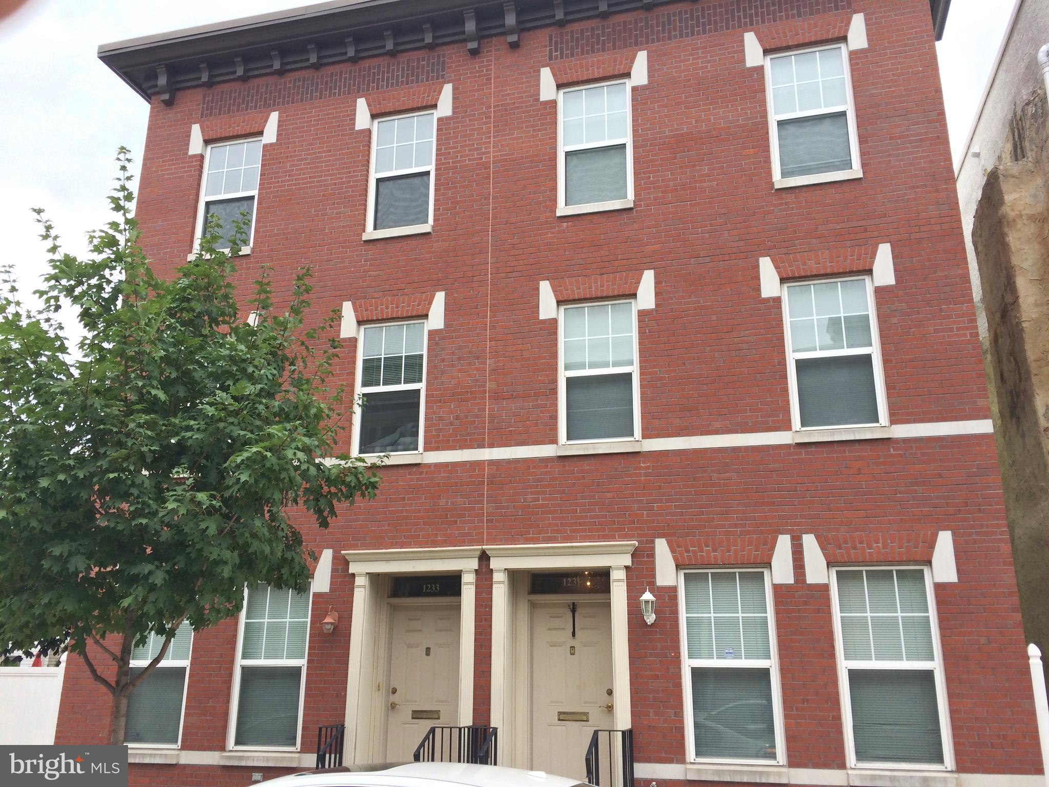 Available 9/1/25! Handsome 4 bedroom, 2 bath home with 2-CAR PARKING! Conveniently located to Avenue of the Arts/Broad St, Italian Market, Center City, Passyunk Ave, public transportation, restaurants, etc. Step into the living/dining room with hardwood floors, two windows, tile wall and 3 closets. The eat in kitchen boasts maple cabinetry, dishwasher and door to a nice yard with access to the TWO CAR PARKING. On the second floor there are two bedrooms with wood floors, windows and closets, plus a full bath off the hall. The third floor features two bedrooms, a laundry room and a full bath with stall shower. Cats okay. This is a great home in a fantastic location. Verifiable income & reasonably good credit are a must. Please refer to the rental application instructions in the docs section to apply. Don't miss!!! Photos are from previous listing.