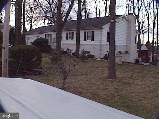 3 Bedroom Rancher on nice wooded lot.  Needs some light cosmetics.  Being sold as-is.  2 car garage with overhead storage.  Enclosed breezeway for extra finished area.