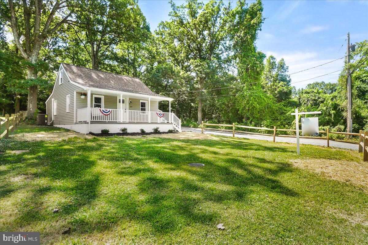 Welcome to this beautifully renovated single-family bungalow just outside Frederick city, ideally located minutes from New Market and I-70, offering easy access to major commuter routes. This charming home has undergone a complete top-to-bottom renovation, ensuring modern comfort and style.

Upon entering, you'll notice the new roof and siding, complemented by fresh landscaping that enhances the curb appeal. Inside, the home features new paint and luxury vinyl plank flooring throughout, creating a warm and inviting atmosphere. The updated kitchen boasts new appliances, while the renovated bathrooms showcase modern fixtures and finishes. The addition of new HVAC and hot water heater ensures year-round comfort as well as new well installed in 2022. 

Situated on a picturesque 1/3 acre lot, the property includes a fenced yard, providing privacy and space for outdoor activities. A 1-car detached garage offers convenient parking and additional storage options.

This home is USDA eligible, offering the opportunity for zero percent financing, making it an attractive option for buyers. 6121 Quinn Rd's original footprint was the exact same as 6111 Quinn Rd, which highlights the potential for future expansion or customization, allowing for endless possibilities to suit your needs.

With its convenient location, modern upgrades, and move-in ready condition, 6111 Quinn Rd is ready to welcome you home. Don't miss the chance to make this your perfect retreat just minutes from all the amenities Frederick has to offer.