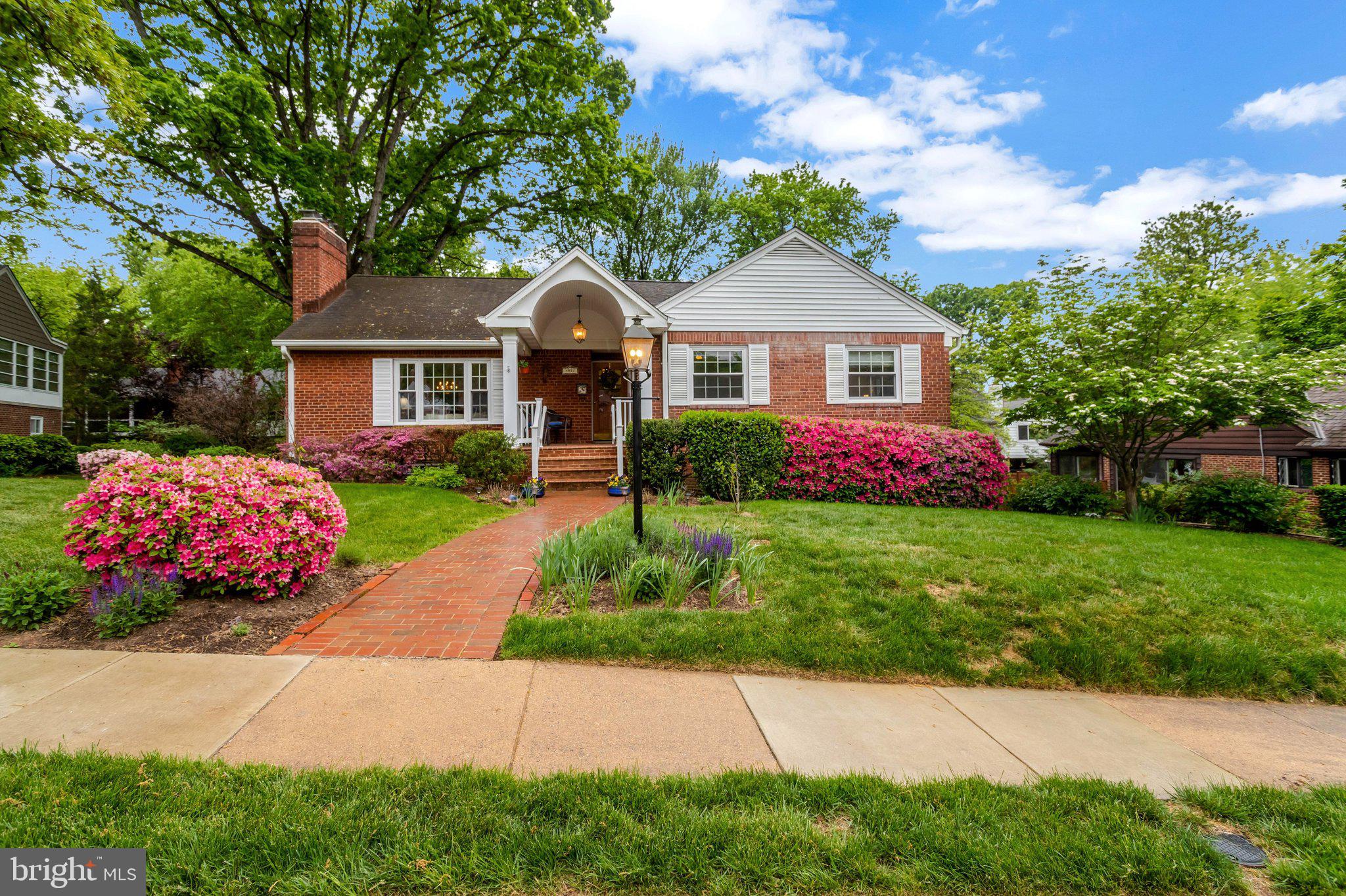 An exceptional opportunity on one of North Arlington's most coveted and prestigious addresses. This beautifully expanded 4 bedroom, 2.5 bath residence has been thoughtfully and elegantly updated, offering a rare combination of timeless sophistication and modern luxury. Gleaming hardwood floors flow gracefully throughout, while soaring Palladian windows flood the principal rooms with an abundance of natural light — a breathtaking first impression that endures. The remodeled granite kitchen opens effortlessly to a magnificent vaulted family room addition, creating an inspired space for both intimate gatherings and grand entertaining. The luxurious owners suite is a private sanctuary, appointed with a spa-inspired shower and generous walk-in closet. The walk-out basement offers exceptional versatility with a recreation room, bedroom, workshop and abundant storage. Lush, professionally landscaped grounds with fully fenced yard provide a serene outdoor retreat. The oversized two car side entry garage and walk-up attic with endless potential complete this remarkable offering. Perfectly positioned minutes from I-66, the GW Parkway and East Falls Church Metro for effortless access to Washington DC. A truly distinguished home for the most discerning buyer.