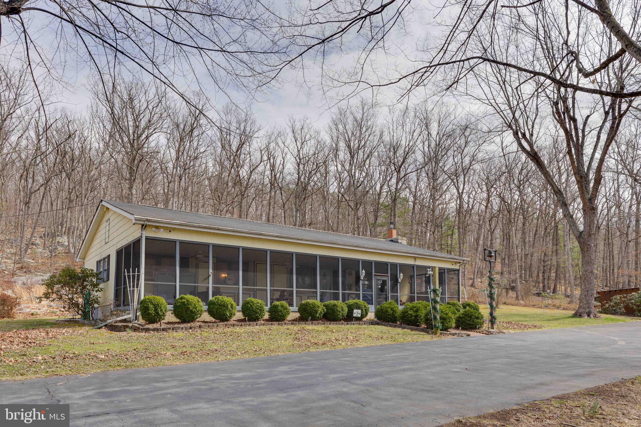7.41 Acres | One-Level Living | 3-Car Garage – Bloomery, WV

Located in historic Hampshire County—West Virginia’s oldest county—, this charming one-level home sits on 7.41 scenic acres offering privacy, comfort, and a peaceful country setting.
The home features 3 bedrooms, 2 full baths, numerous updates, and a spacious 3-car detached garage—perfect for vehicles, hobbies, or additional storage.
A highlight of the property is the full screened porch, an ideal place to enjoy quiet mornings, relaxing evenings, and fresh mountain air while overlooking your private acreage.
With 7.41 acres to explore, the property offers plenty of space for gardening, outdoor activities, or simply enjoying the surrounding natural beauty.

The area is known for its scenic landscapes and outdoor recreation, with nearby access to Cacapon Resort State Park, the Cacapon and Potomac Rivers, and miles of mountain countryside perfect for hiking, fishing, and exploring. Local destinations like Bloomery Plantation Distillery add to the charm of the area.
Whether you're looking for a full-time residence or a weekend retreat, this property offers the space, privacy, and relaxed pace of West Virginia country living.