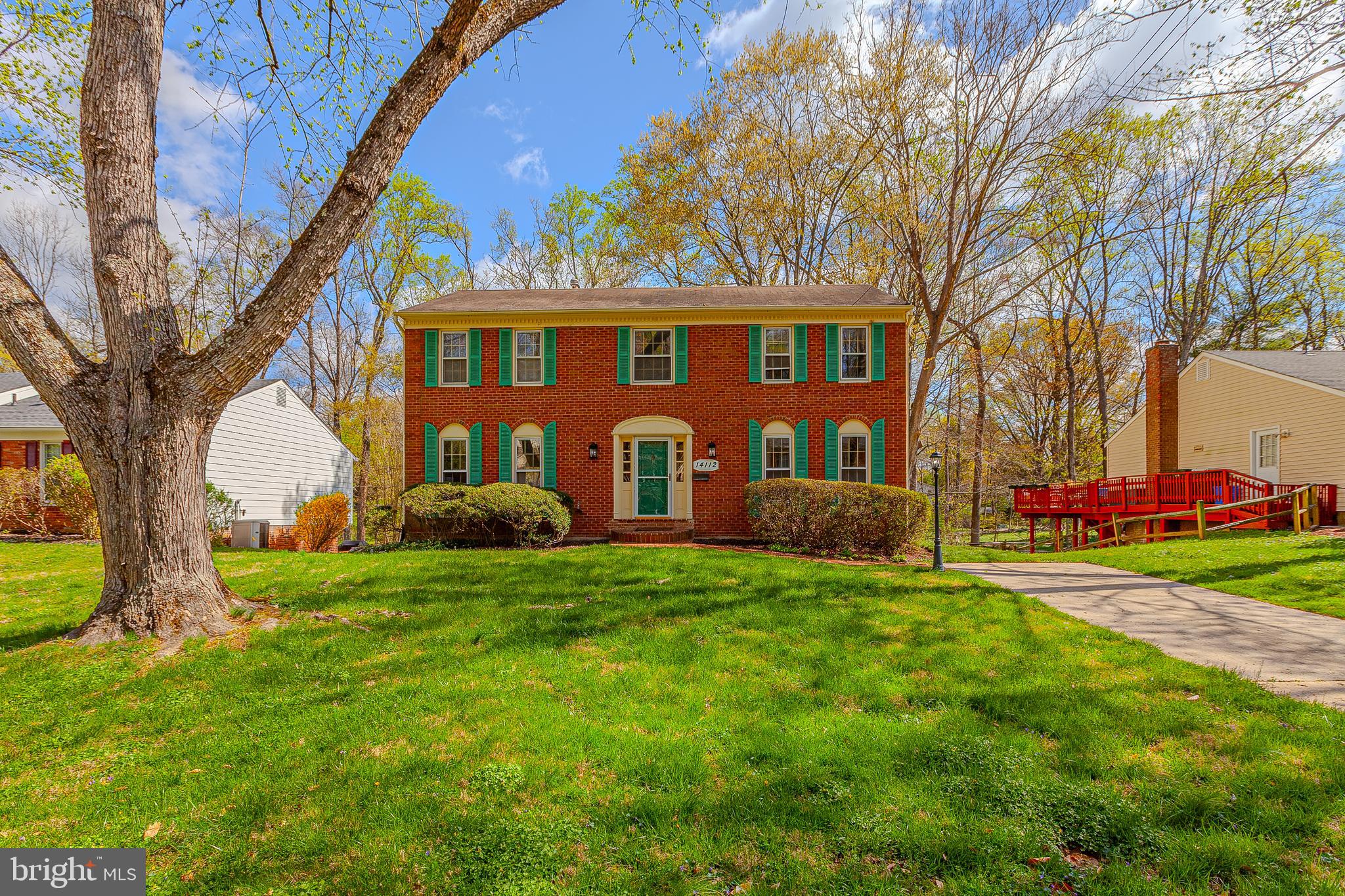Open House Saturday April 12th (1-3pm) and Sunday April 13th (1-3pm) - This elegant, brick front, colonial home sits on a premium lot in Rockville's sought after community of Bel Pre Woods!  A bright and spacious main level holds a welcoming foyer, a living room with beautiful built-ins, a large dining room, a relaxing family room, an updated, eat-in kitchen, and a convenient main level laundry room! The upper level holds three sizable guest rooms, a hall bathroom, and a private primary suite with walk in closet and en-suite bathroom! A partially finished, walk out lower level holds a large recreation room, a utility room, and plenty of storage space!  A recently constructed deck is perfect for summertime entertainment and offers spectacular views of a serene backyard! Enjoy recently refinished hardwood floors, a freshly painted interior, a newly installed deck, and several other attractive updates! Enjoy close proximity to both sides of Red Line Metro, area schools, local shopping, and Rock Creek Park! Come quickly!