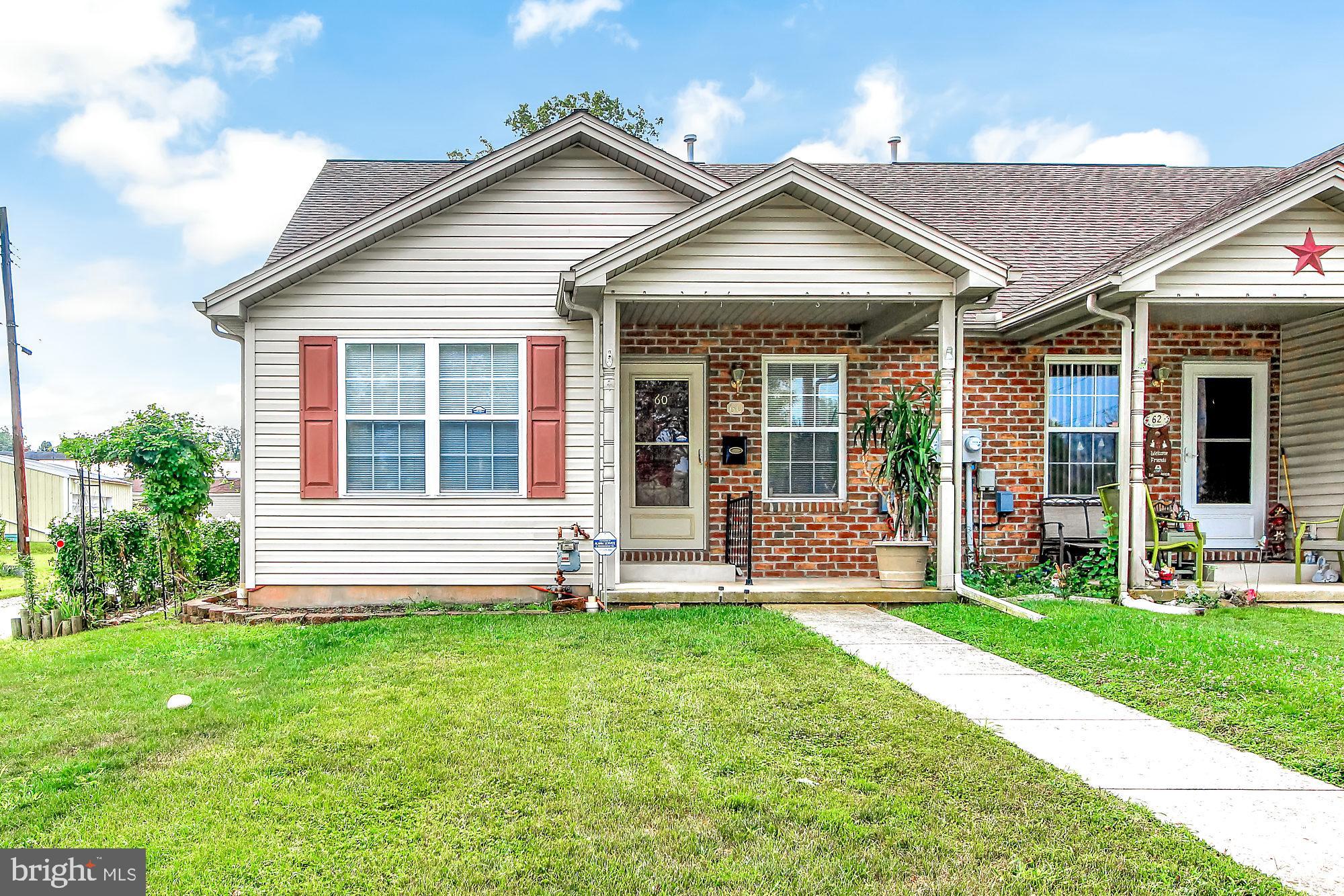 Want to be rid of steps? Enjoy one story living here in this two bedroom end unit with attached garage. The combined living / dining area offer entertaining space for your family and friends. Relax outside on either the cozy front porch or backyard patio. Leave those stairs behind and see how this house can become your HOME!