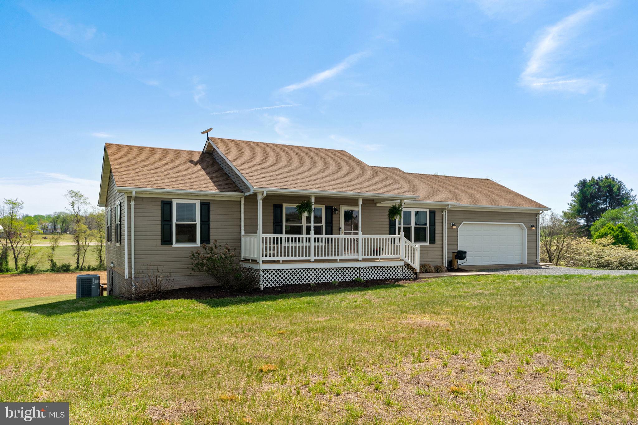 *Get up to $2,500 with use of preferred lender for closing cost assistance or use funds for a rate buy-down (restrictions apply and not all will qualify, contact listing agent for details)
Turn-Key Rambler on 3 Private Acres with Stunning Upgrades! Welcome home to this beautifully maintained 2006-built rambler offering approximately 2,912 sq ft of comfortable living space on a spacious 3.06-acre lot. Tucked away on a quiet private road in Reva, this 3/4-bedroom, 3-bath single-level home boasts peaceful pastoral views and mountain vistas just across the street—perfect for those seeking rural tranquility while remaining convenient to Culpeper and surrounding areas.
Step inside to an open, bright layout featuring hardwood flooring and granite countertops installed in 2021. The fully finished basement (added in 2022) expands your living options with flexible space ideal for a family room, home office, gym, or guest suite.
This home has been lovingly upgraded with major systems and features you’ll truly appreciate:
• 2025: All new Pro-Via windows installed
• 2024: Rear deck fully replaced + 1,000-gallon buried propane tank
• 2022: New roof + stamped concrete patio
• 2021: New HVAC system + hardwood floors + granite countertops
• 2018: New well pressure tank, Navien tankless water heater, and whole-home water softener
• 2026: New submersible well pump
Additional highlights include a stamped concrete area, a generous deck for outdoor entertaining, and a private, wooded setting that offers privacy and serenity.
Whether you’re looking for a move-in-ready family home or a peaceful retreat, this property delivers exceptional value with recent updates throughout. Don’t miss your chance to own this upgraded gem in desirable Reva!
Ready for showings – schedule your private tour today!